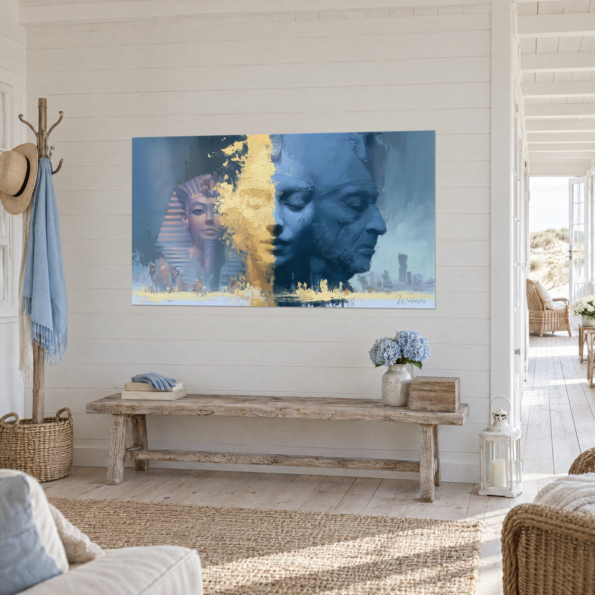 Wall art double Egyptian face, slate blue profile facing a yellow gold flow, three-quarter view in a light hallway