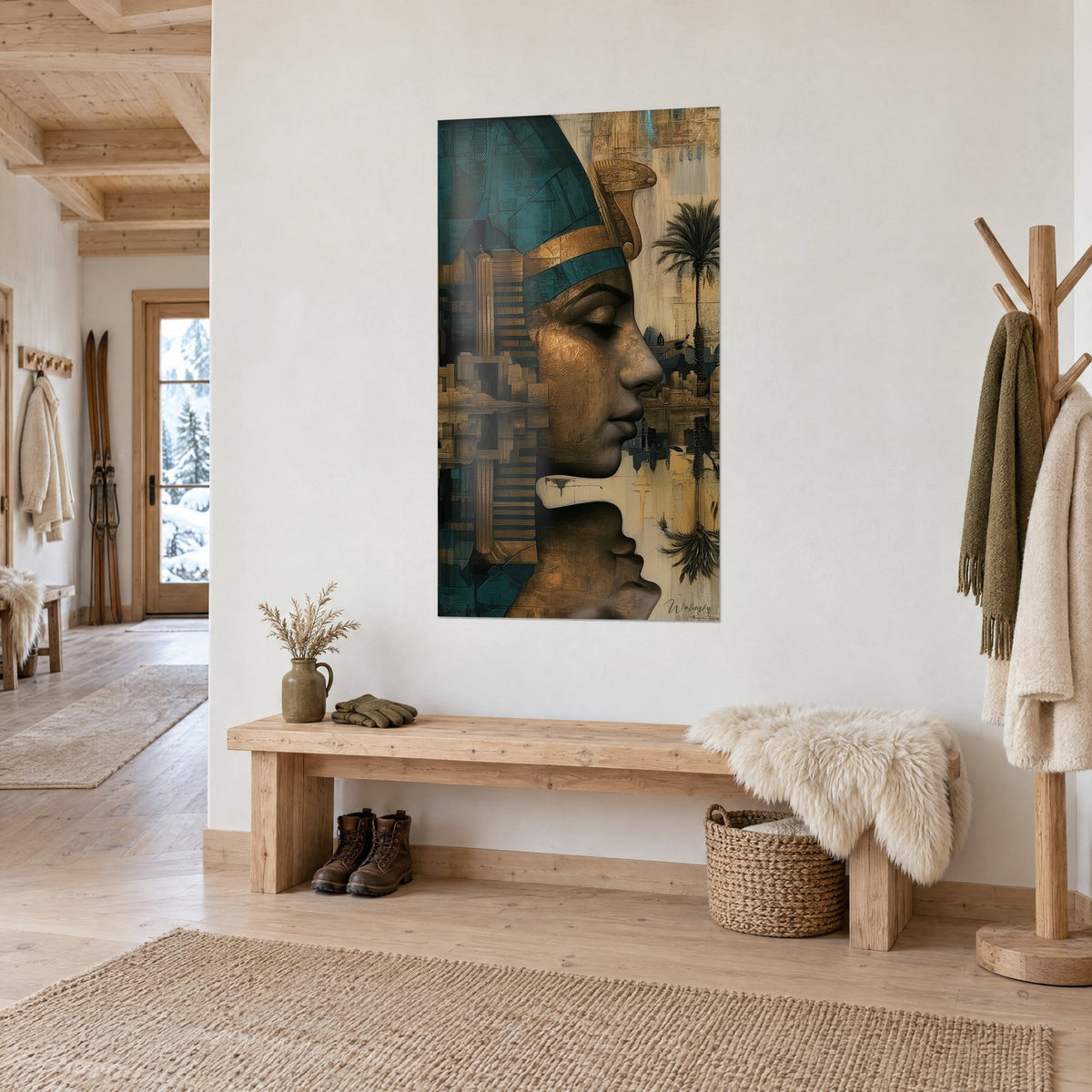 Wall art of an Egyptian queen's face with closed eyelids, ochre and teal, ghost town, chalet entrance