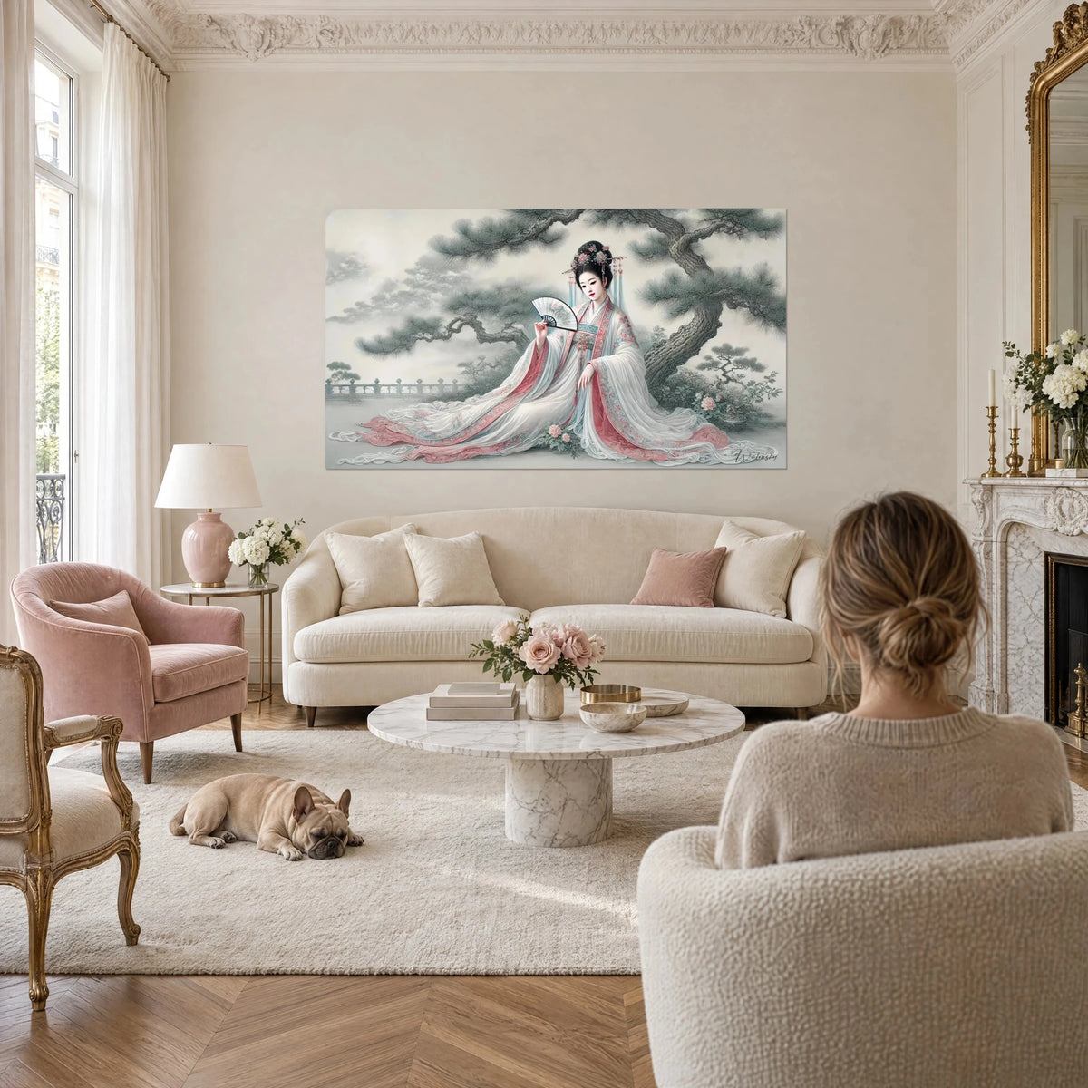 Wall art of a young woman in a white and pink hanfu holding a fan beneath a gnarled pine, above a sofa in a bright living room