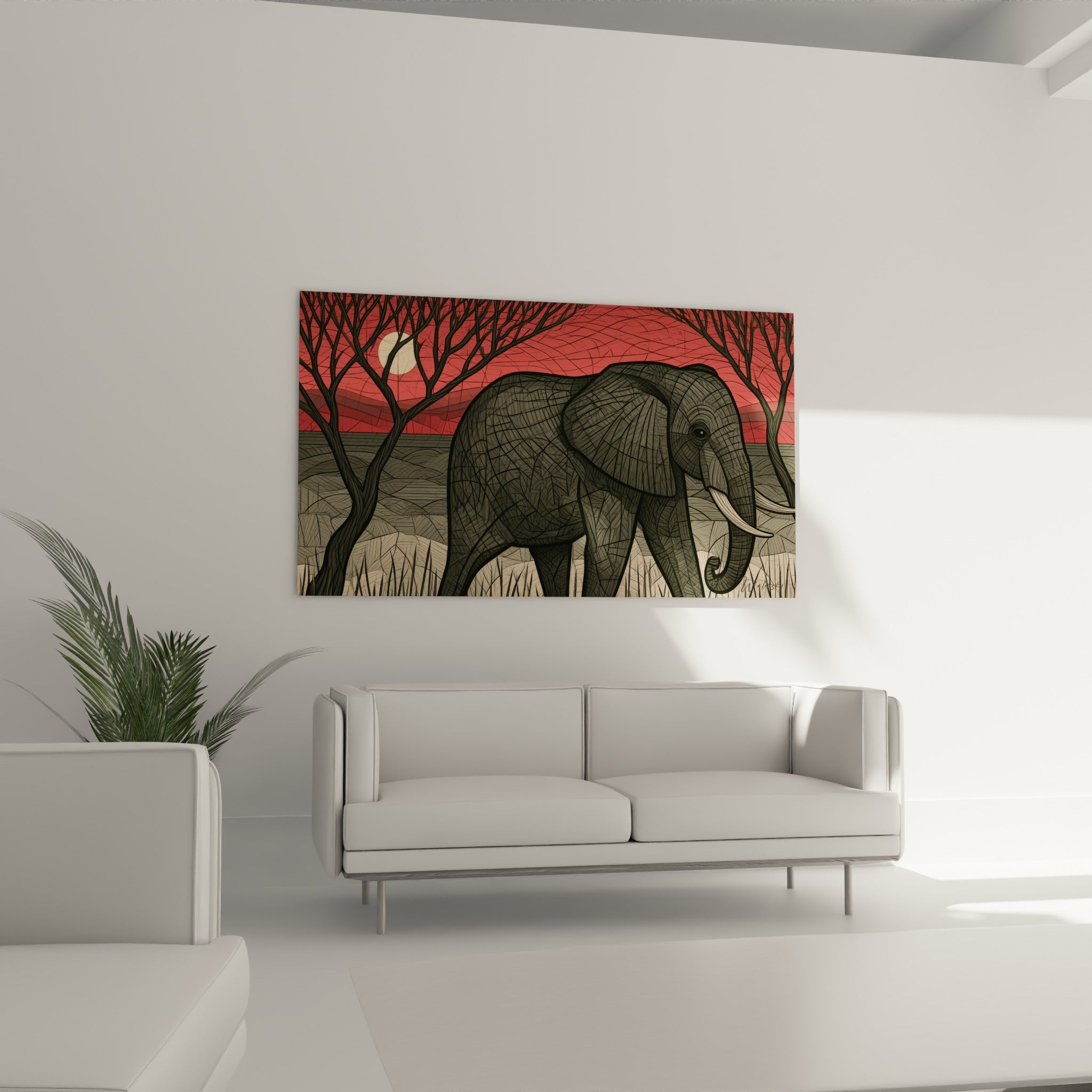 Défense blanche et peau texturée d'un éléphant anthracite disposé au-dessus d'un canapé dans un salon lumineux