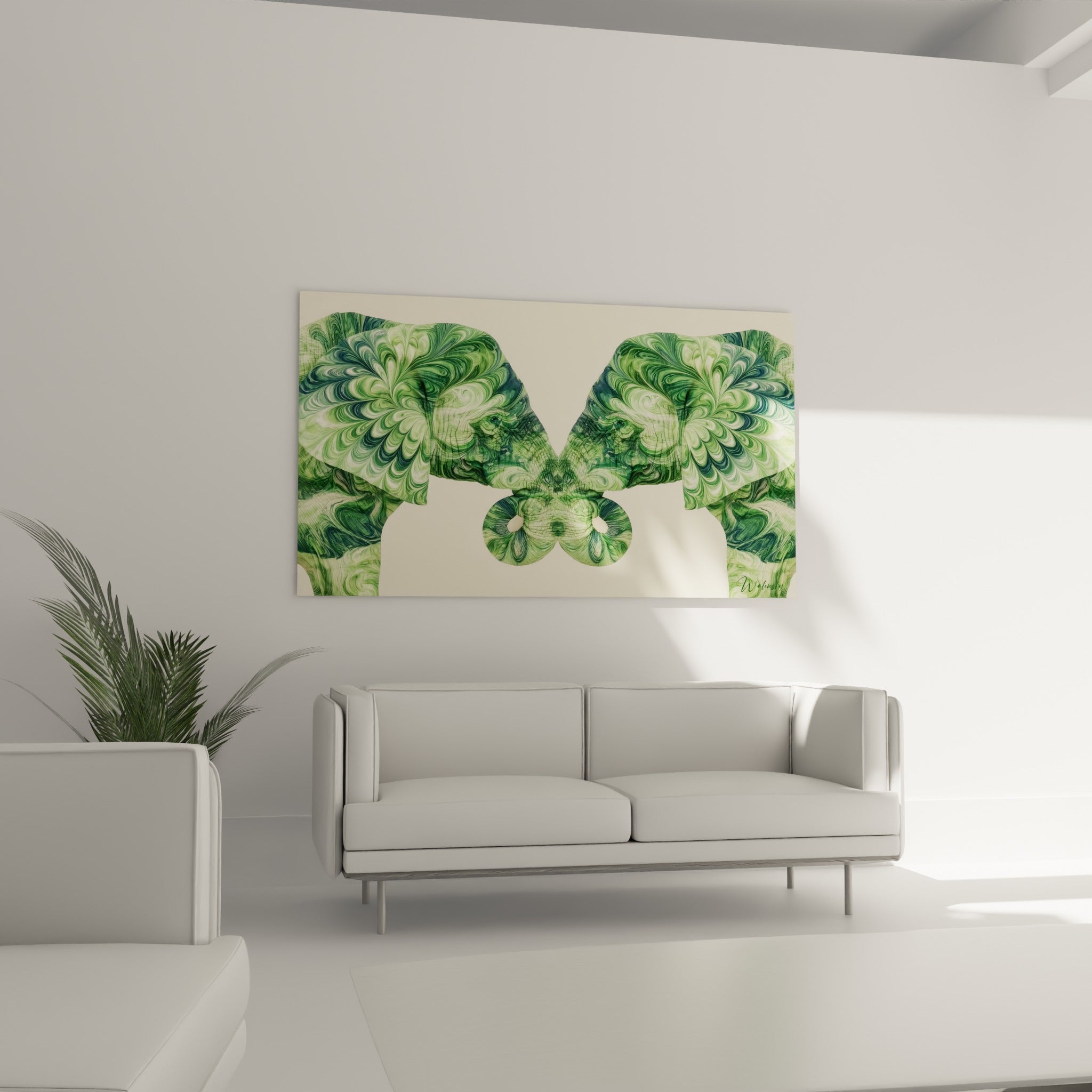 Symétrie végétale de l'éléphant vert sauge et blanc crème au-dessus d'un canapé dans un salon lumineux
