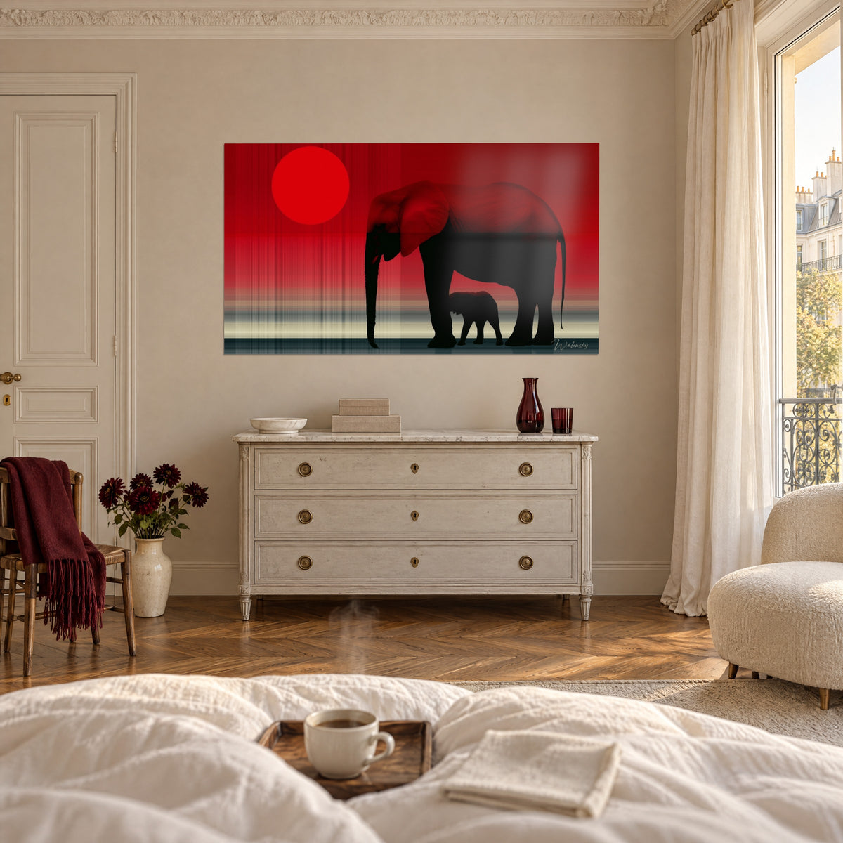 Wall art elephant family cut out in black against a blood-red sky, round sun, white chest of drawers, above a bed in a bright bedroom