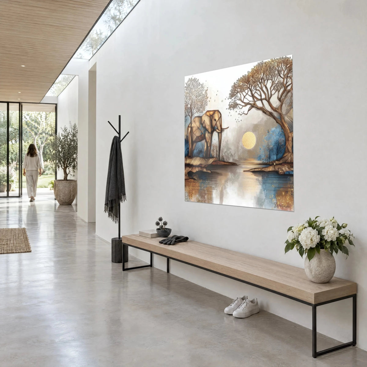Wall art polygonal ochre pachyderm by the edge of a lake, large tree with brown branches and golden moon, three-quarter view in a sunlit hallway