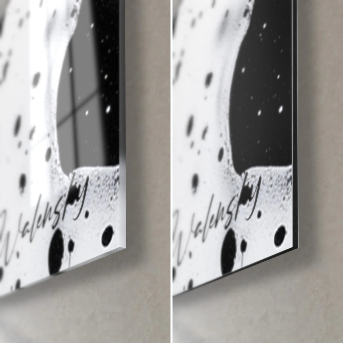 Cuadro de salpicaduras negras sobre blanco, detalle de la esquina inferior derecha: cristal acrílico brillante a la izquierda, aluminio Dibond mate a la derecha, canto de 3 mm