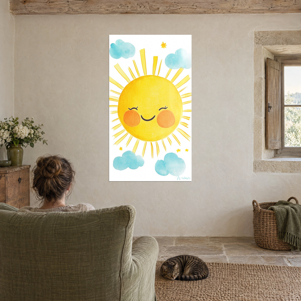 Wall art of a small round sun with drawn eyelashes, golden yellow and light blue, facing a green armchair and a sleeping tabby cat