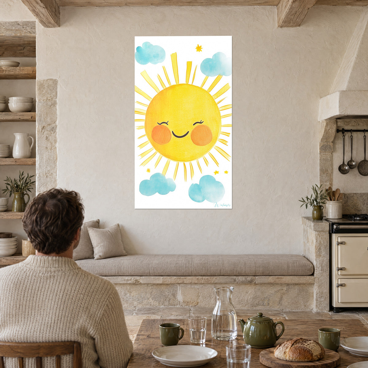 Wall art of a round, chubby-cheeked sun disc on a white background, golden rays and blue clouds, facing a rustic wooden farmhouse table