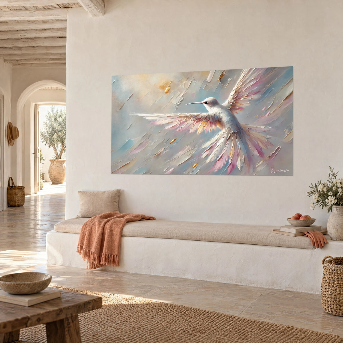 Wall art hummingbird in full flight, cream and pink palette-knife strokes on sky blue background, whitewashed wall of a Mediterranean house