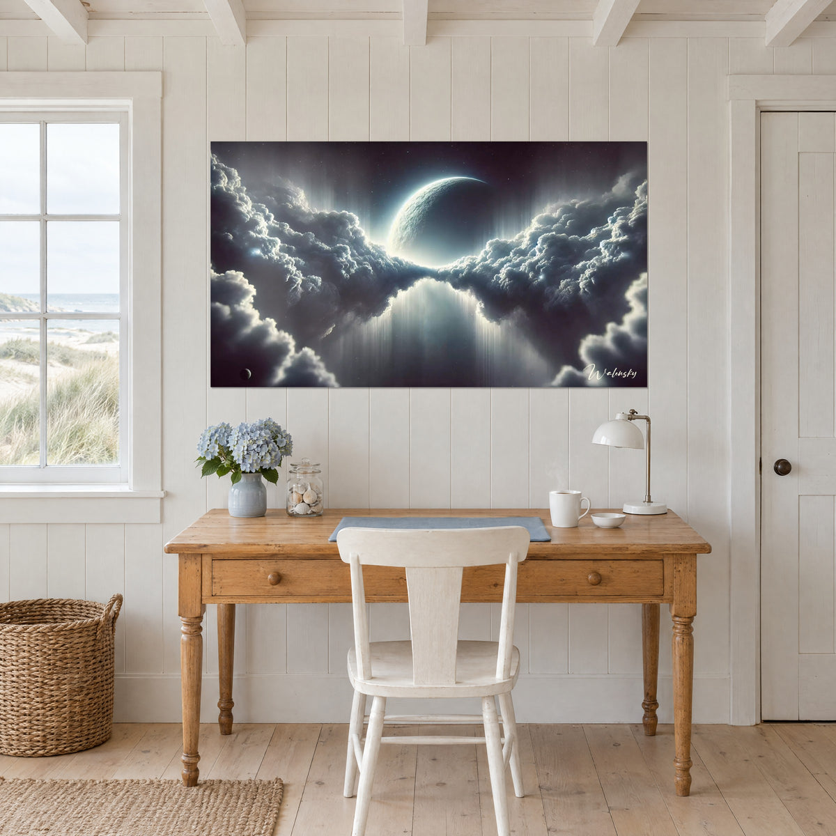 Wall art luminous celestial body rising from a bank of midnight blue and silver clouds, hung above a pine desk