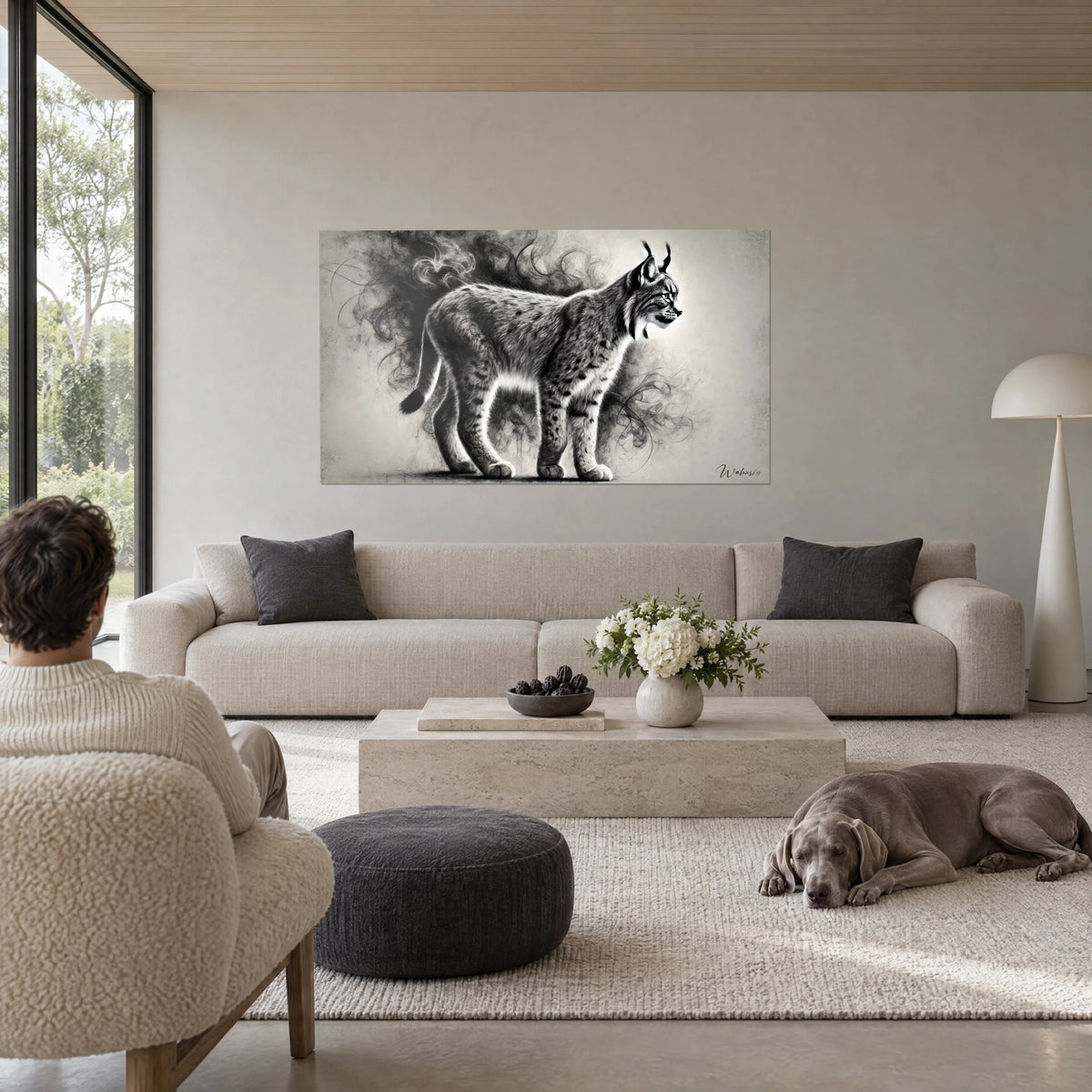 Wall art profile lynx with brush-tipped ears, mottled grey coat, black smoke in swirls, above a sofa in a bright living room