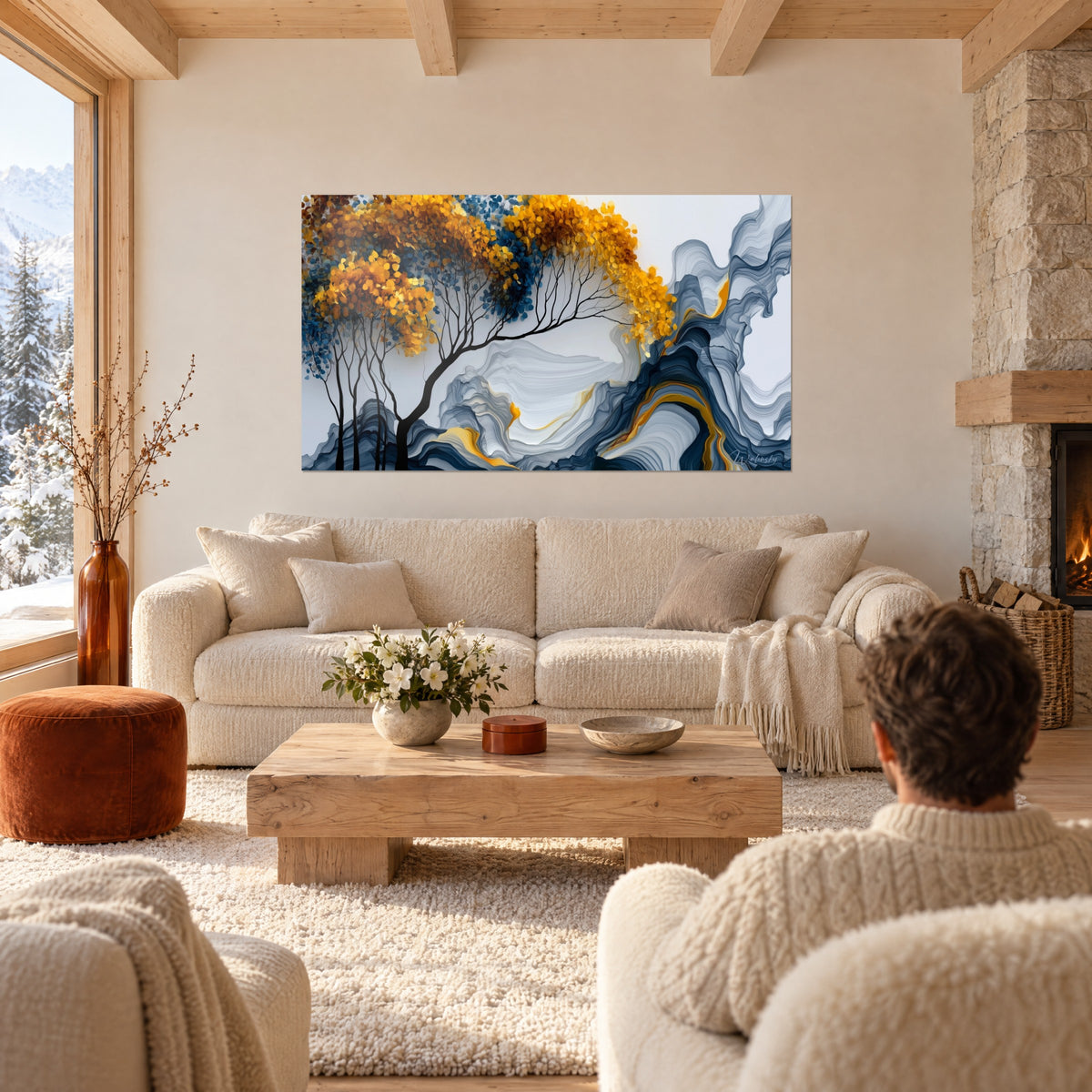 Tableau arbre aux feuillages dorés et bleus sur volutes grises, branches noires effilées, au-dessus d'un canapé dans un salon lumineux