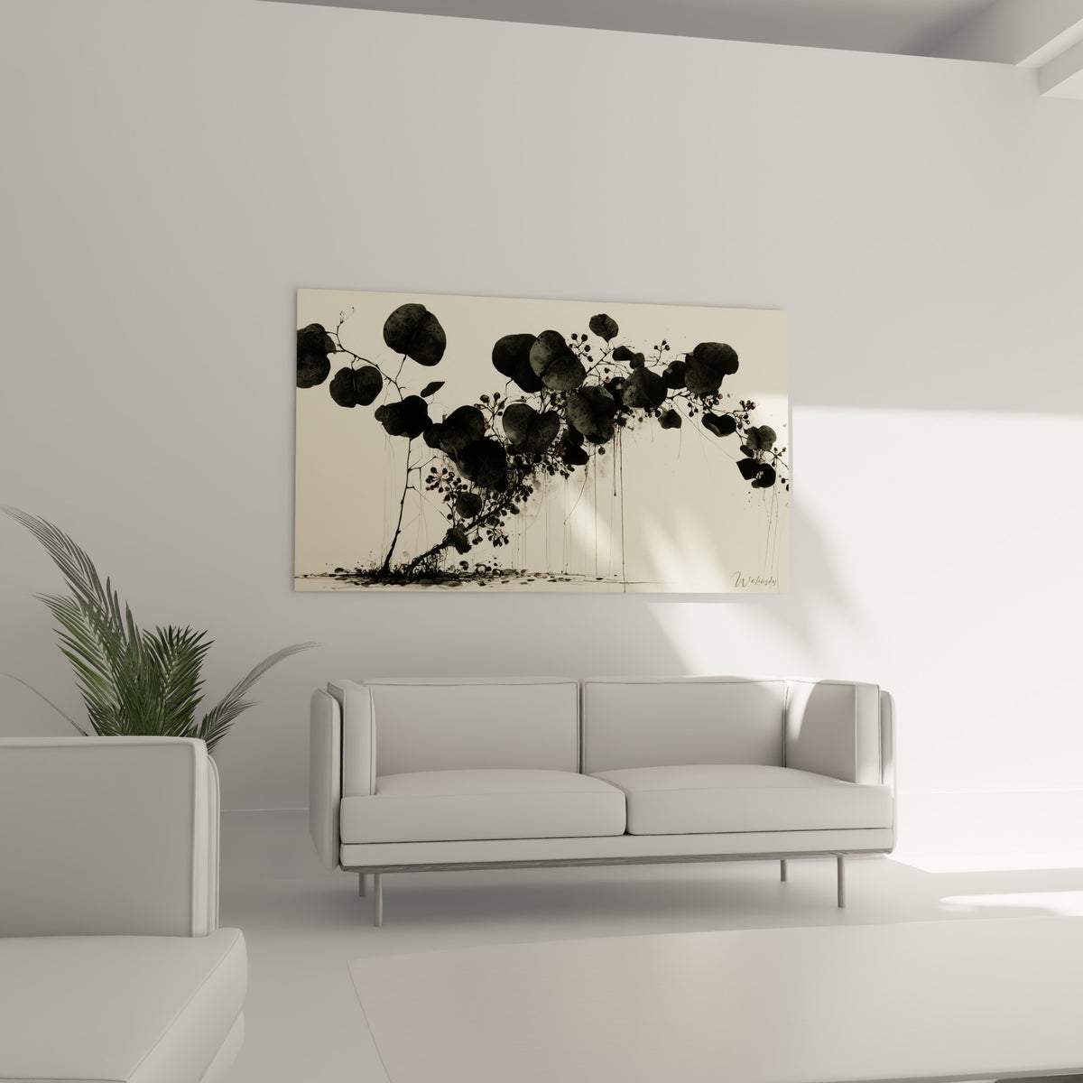 Composition botanique d'Eucalyptus en noir et ivoire, suspendue au-dessus d'un canapé dans un salon lumineux