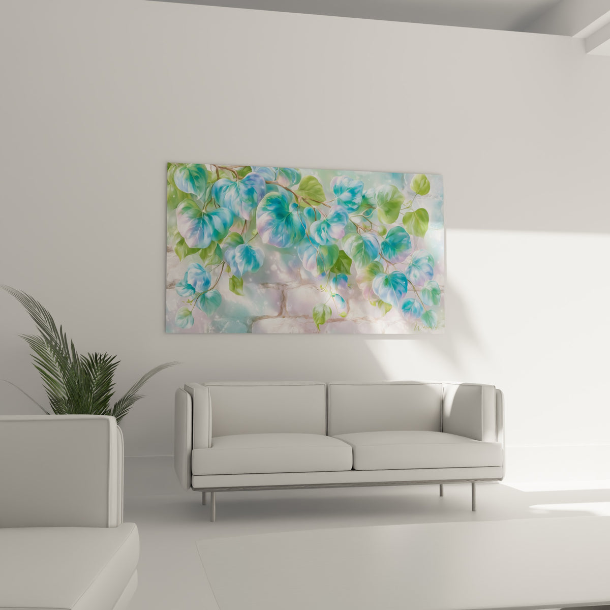 Feuillage d'Eucalyptus bleu lilas et vert amande disposé au-dessus d'un canapé dans un salon lumineux