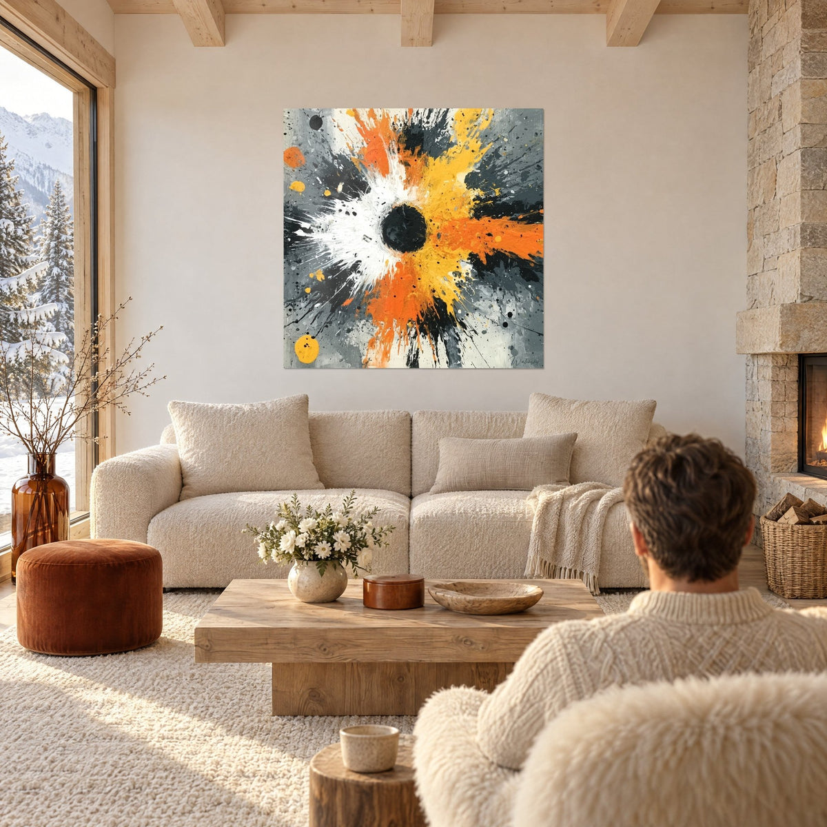 Gemälde Farbexplosion in leuchtendem Orange und Gelb um eine schwarze Scheibe, über einem Sofa in einem hellen Wohnzimmer