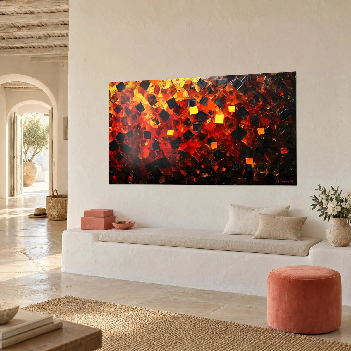 Wall art with a mosaic of ebony and incandescent orange squares, hung in a Mediterranean house, seen three-quarter view