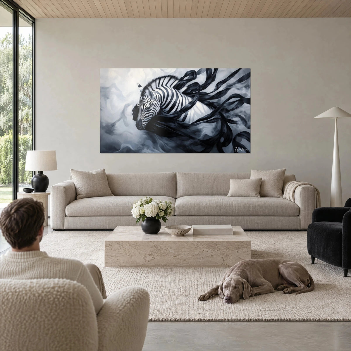 Wall art black and white striped zebra entwined with ink ribbons, pearl grey background, seen from behind above a sofa in a bright living room