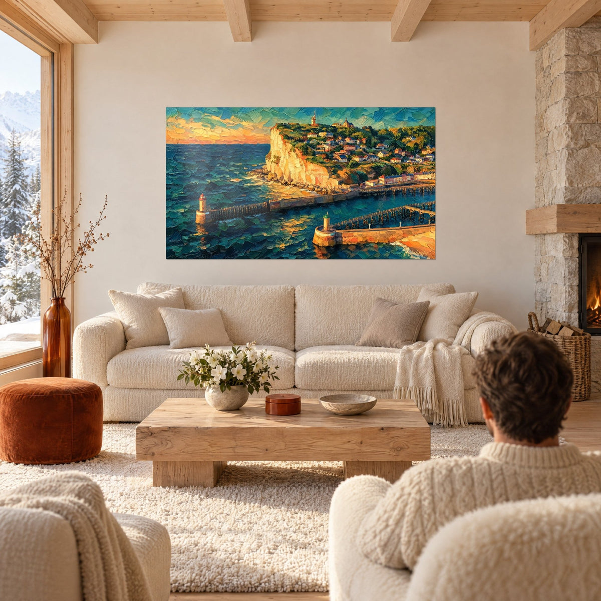 Wall art ochre chalk cliff overlooking a Normandy harbour, turquoise breakwaters, couple seen from behind above a sofa in a bright living room