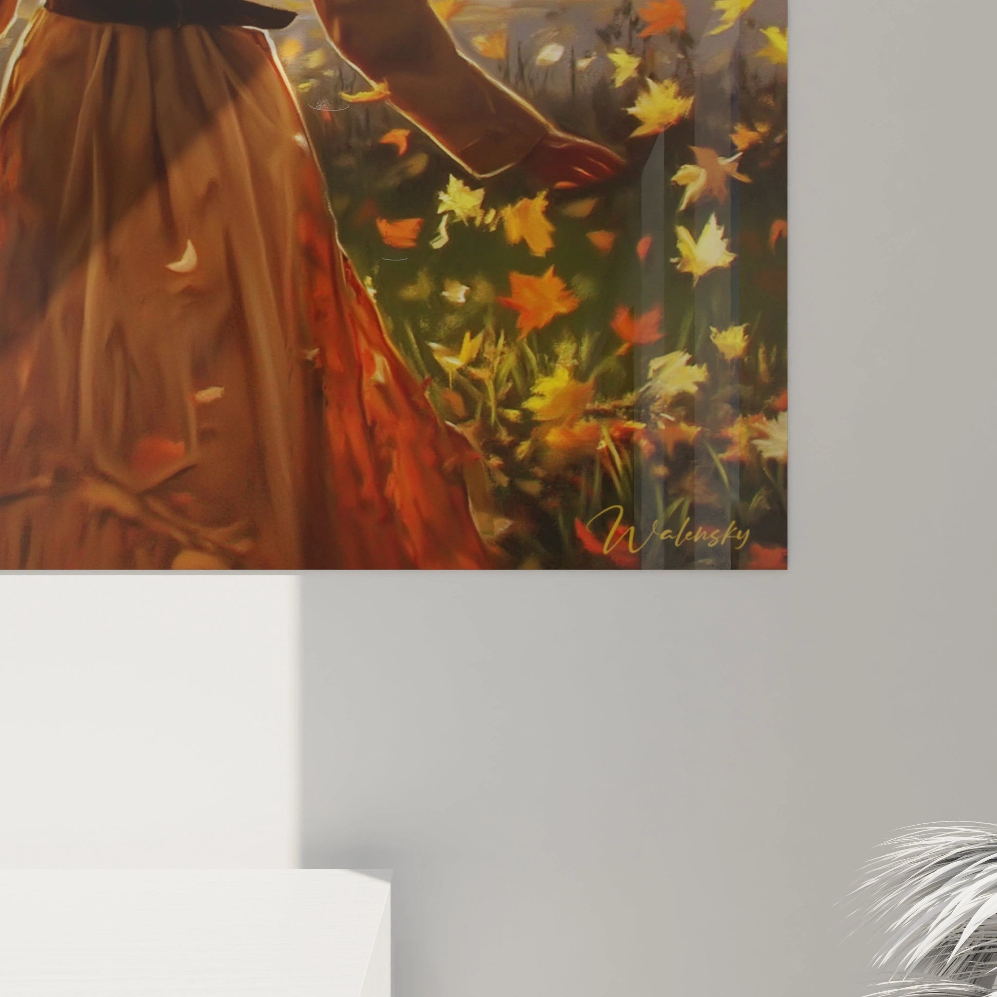 Tableau mural Walensky tableau femme automne avec une robe orange main étendue et feuilles tombantes