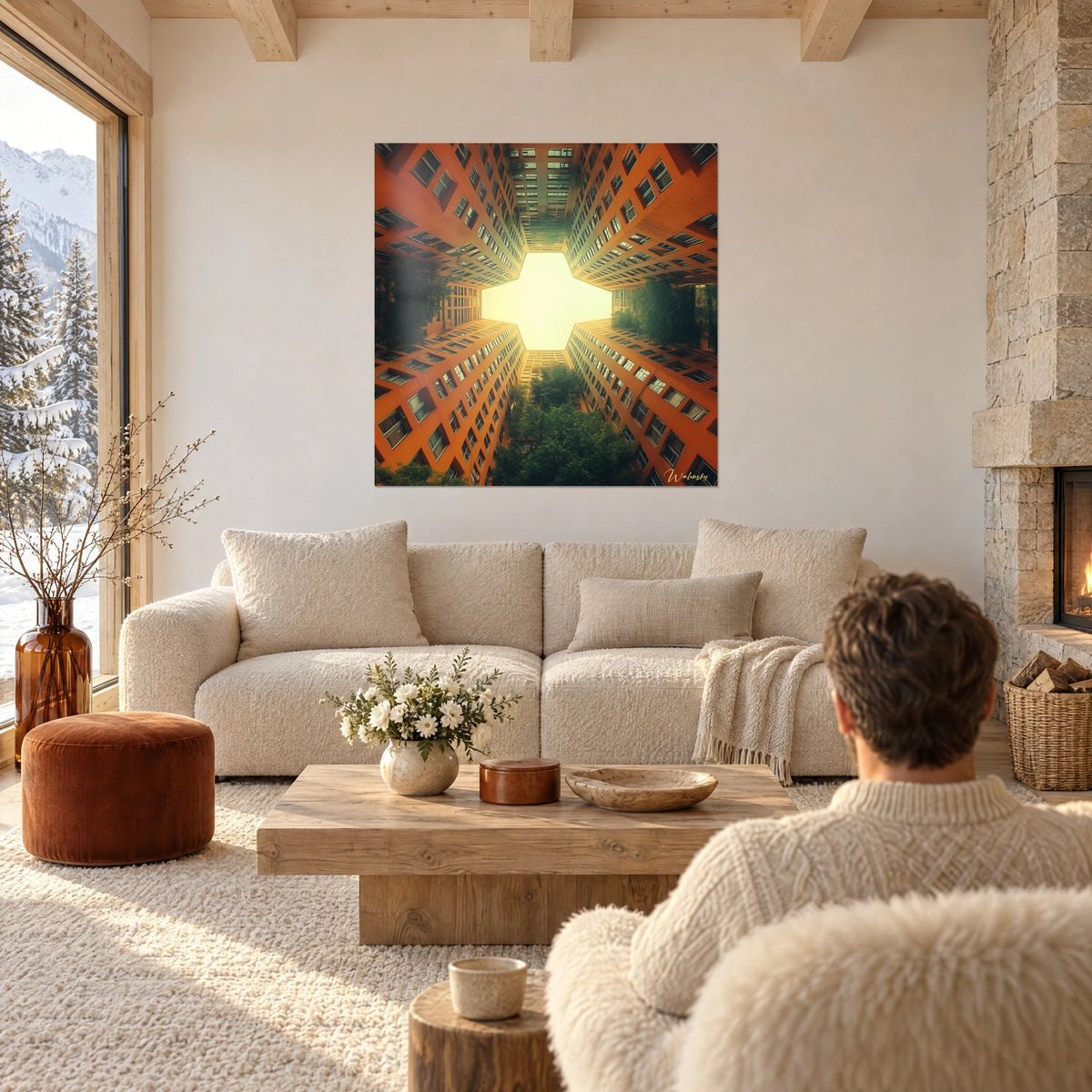 Gemälde orangefarbener Wohnblöcke aus der Froschperspektive vor cremefarbenem Himmel, grünes Laub, über einem Sofa in einem hellen Wohnzimmer