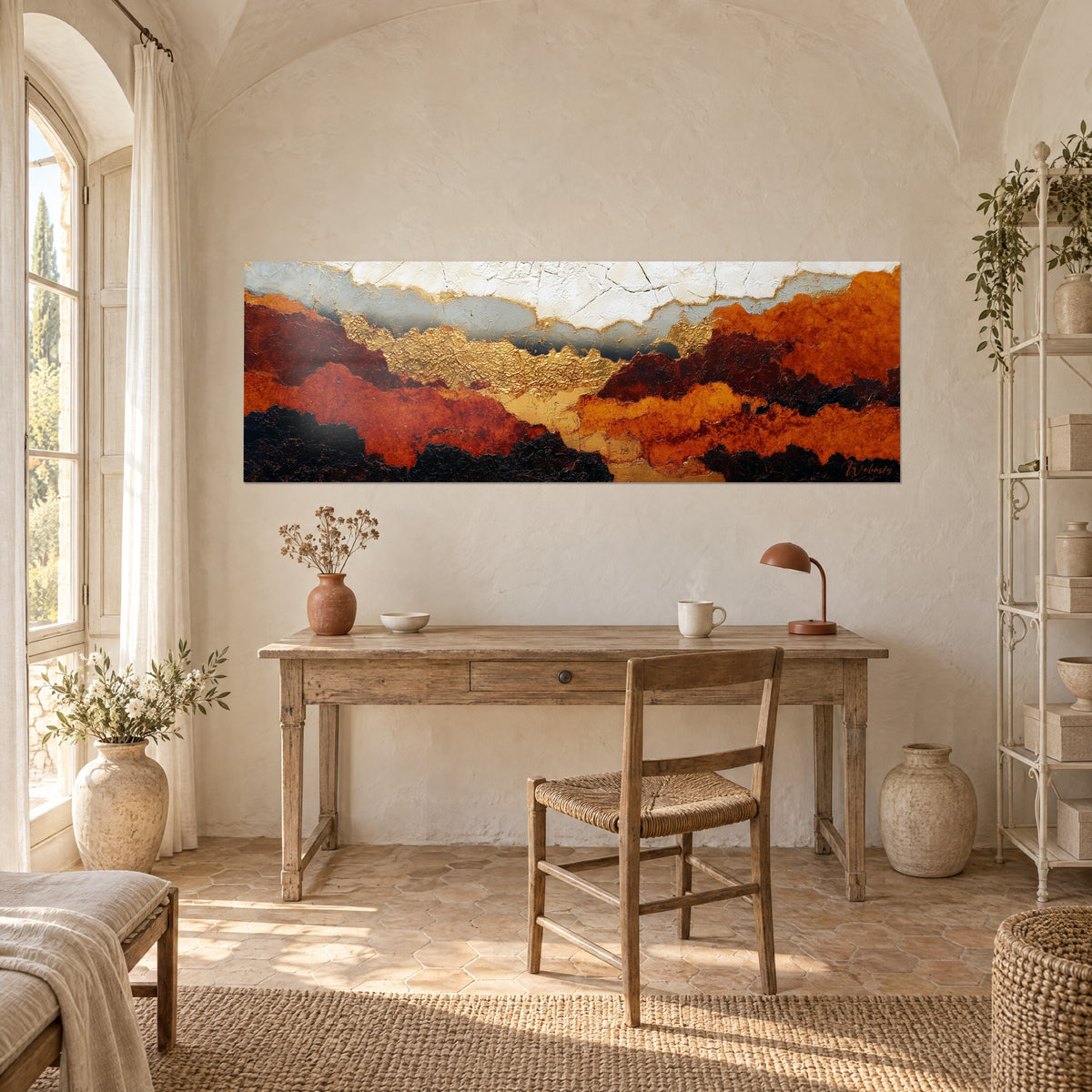 Wall art golden valley between rust and jet-black massifs, hung above a wooden desk in a Provençal farmhouse