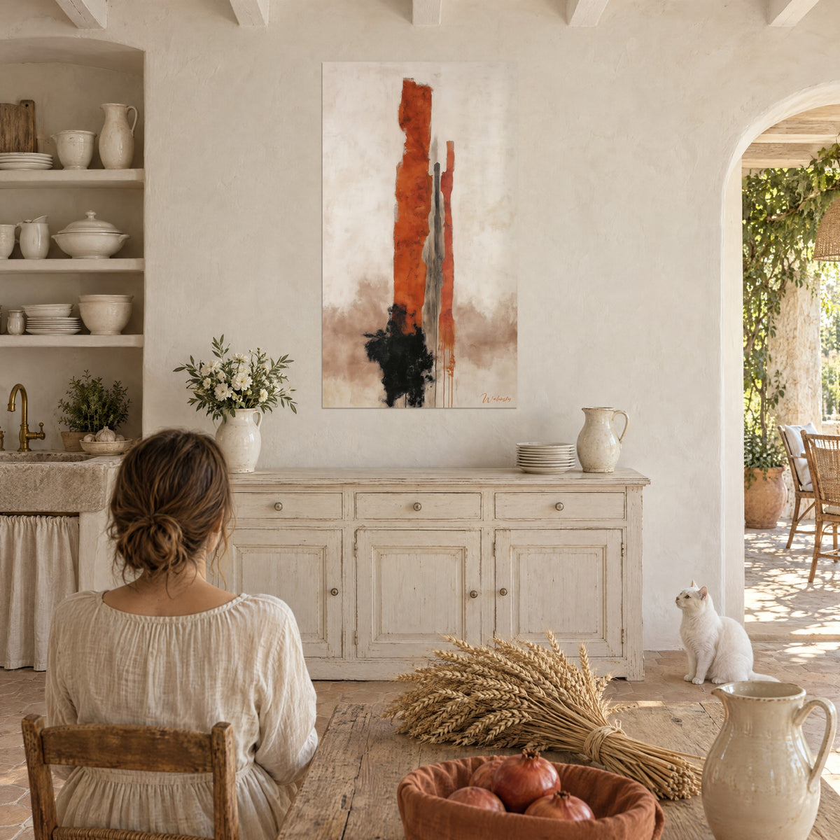 Wall art abstract rust totem on off-white background, black ink splash, young woman seen from behind and white cat in a Provençal farmhouse