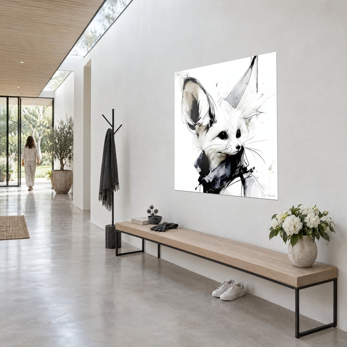 Wall art desert fox with onyx eyes, wispy whiskers, black and midnight blue scarf, light wall and wooden bench in a hallway