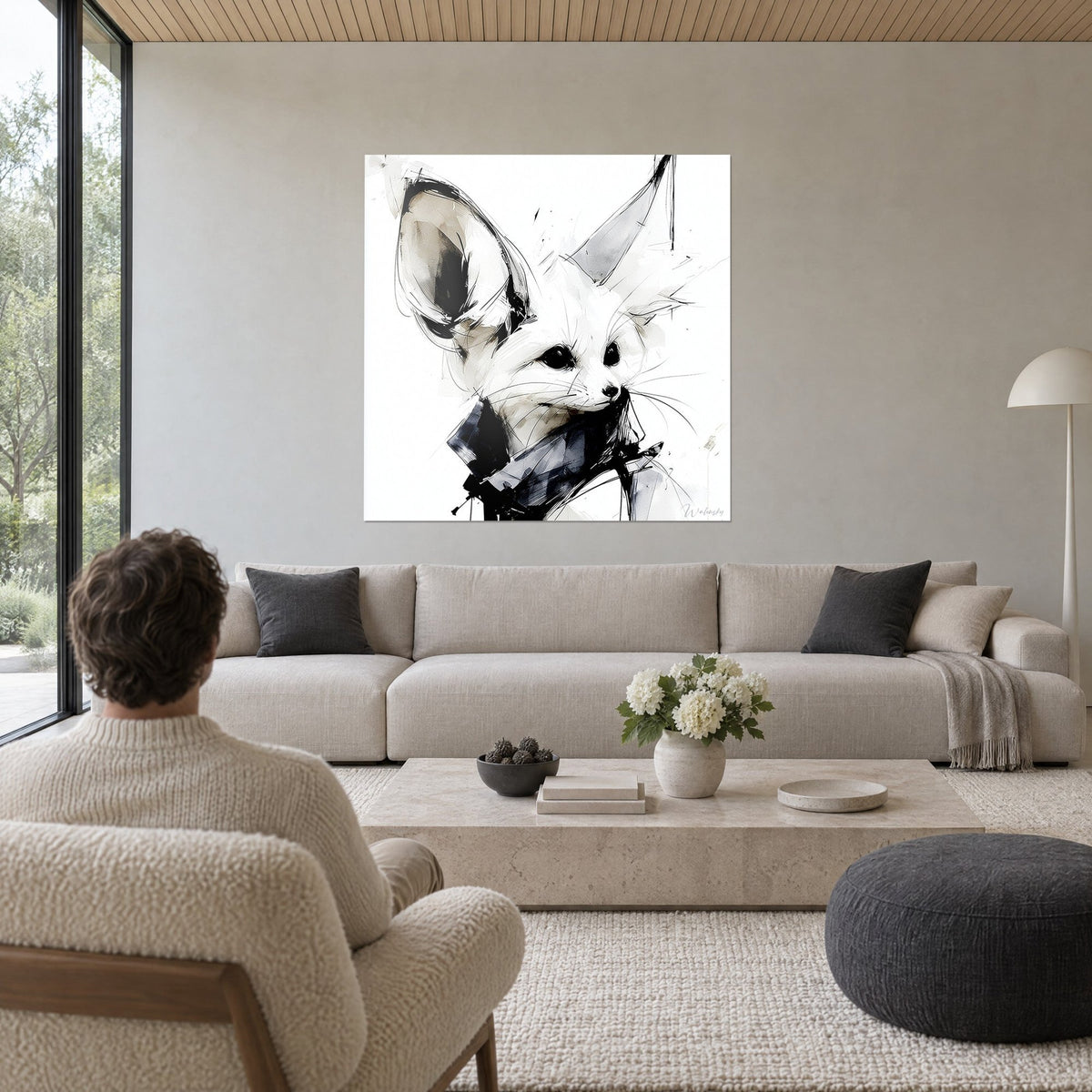 Wall art white fennec fox with huge ears, black ink lines and grey wash, man seen from behind, above a sofa in a bright living room