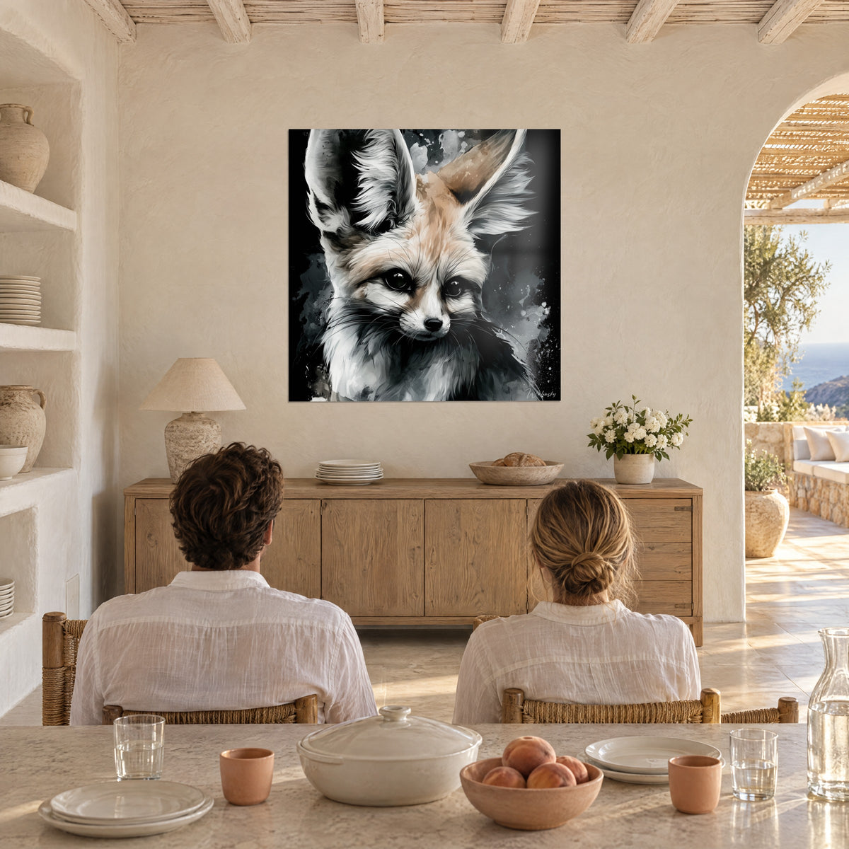 Wall art fox with white mask and glossy black eyes, anthracite grey splashes, facing a couple seated at a table in a vaulted room