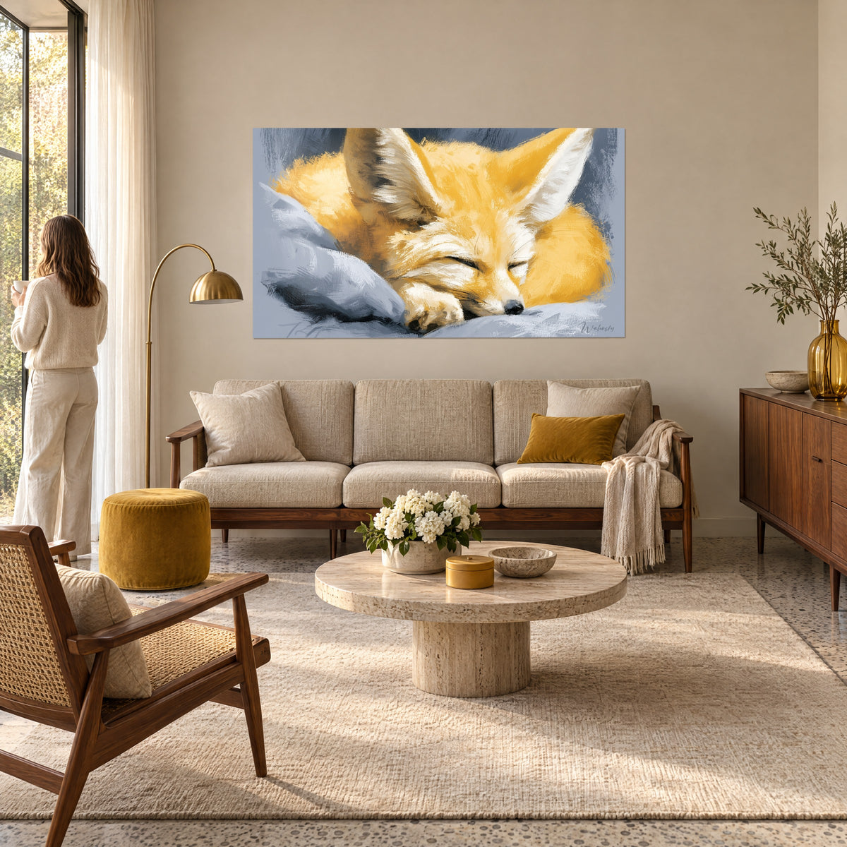Wall art of a curled-up desert fox in saffron yellow on a blue-grey cushion, large ears, above a sofa in a bright living room