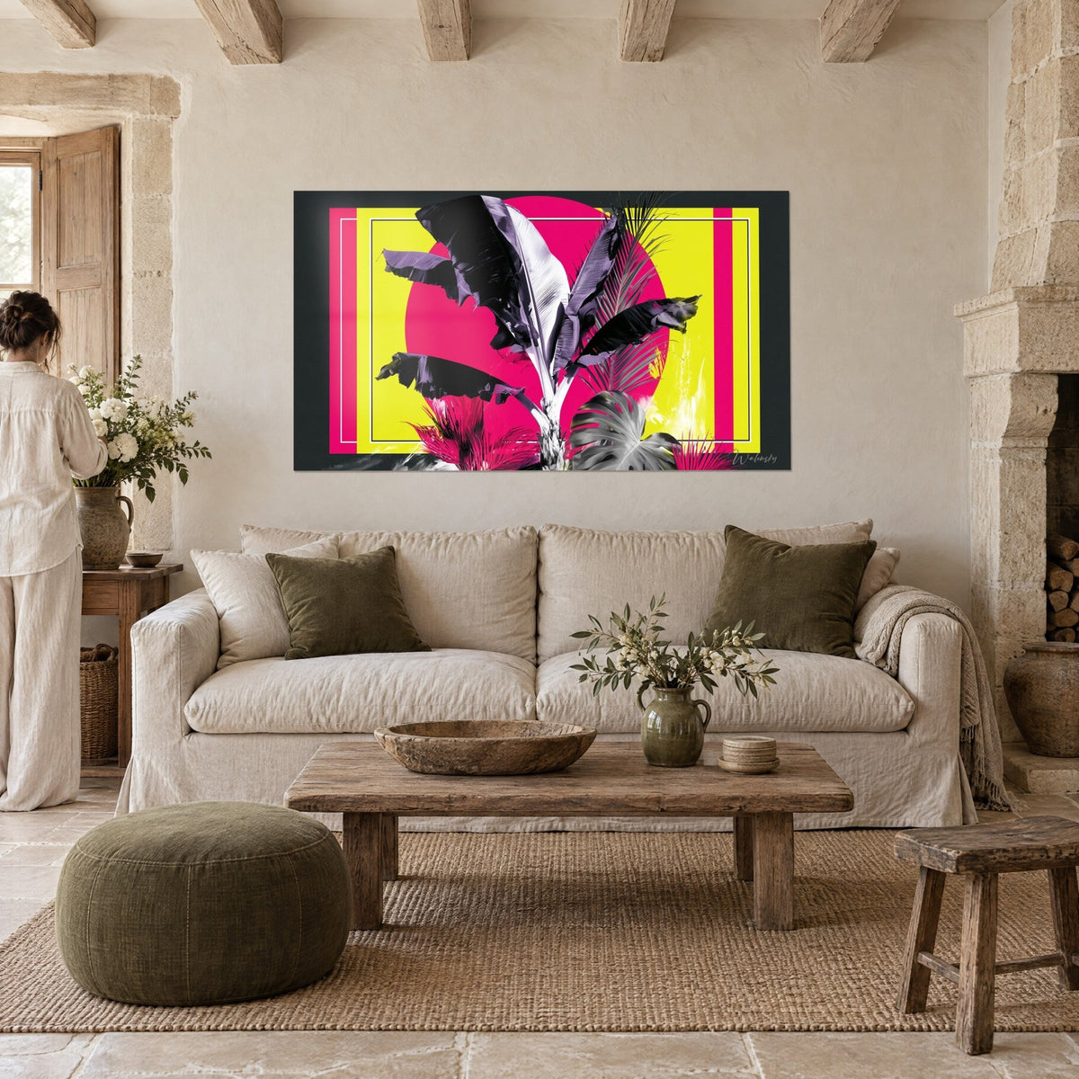 Wall art banana plant with large black leaves on a bright pink disc and lemon yellow background, above a sofa in a bright living room