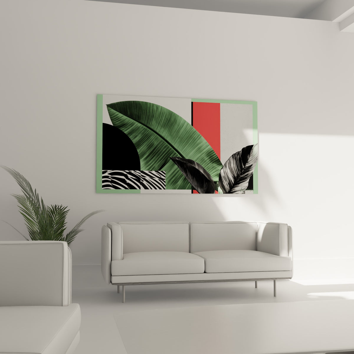 Feuille de bananier verte contrastée d'aplats corail et noir au-dessus d'un canapé dans un salon lumineux