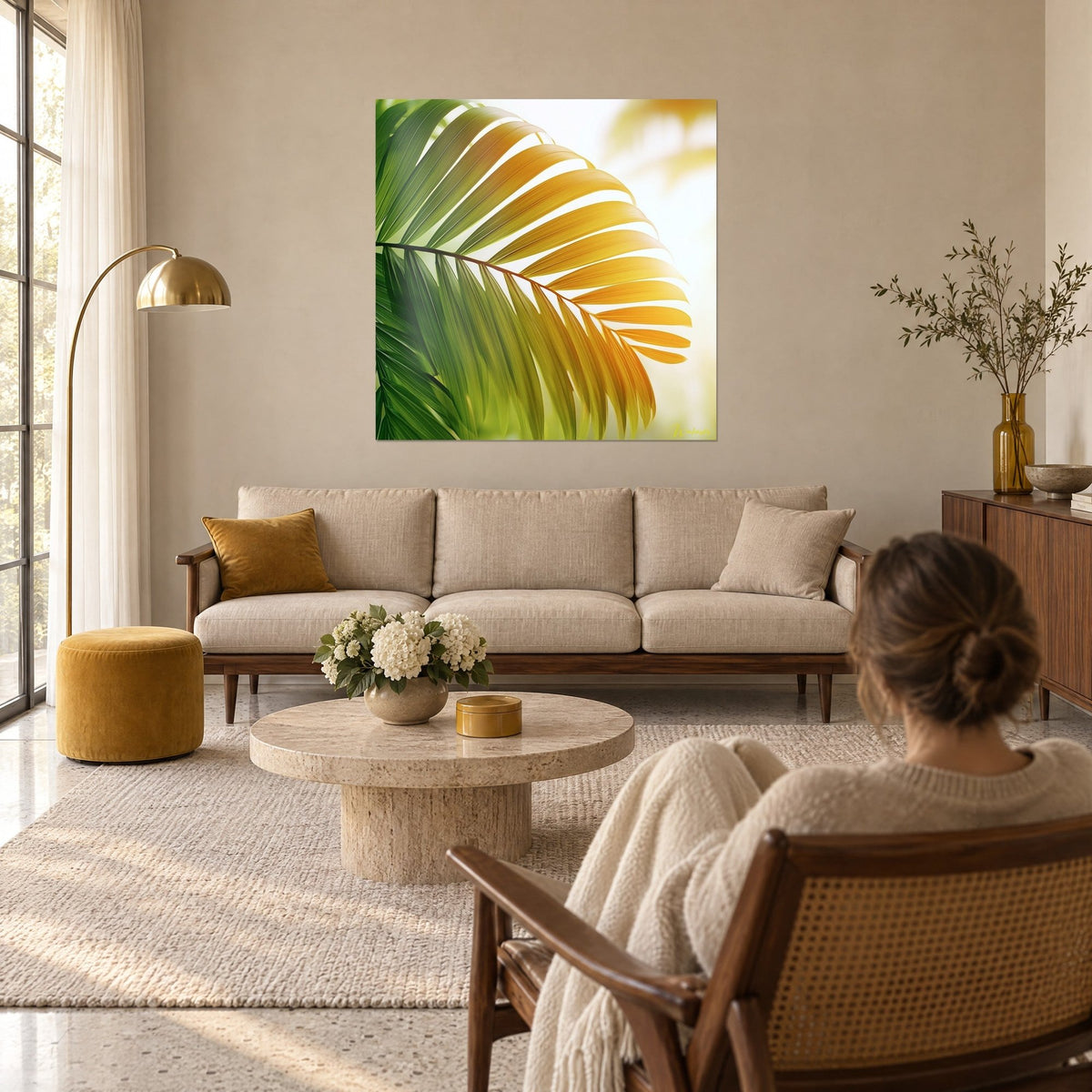 Wall art brilliant green and gold palm frond against the light, luminous leaflets, above a sofa in a bright living room