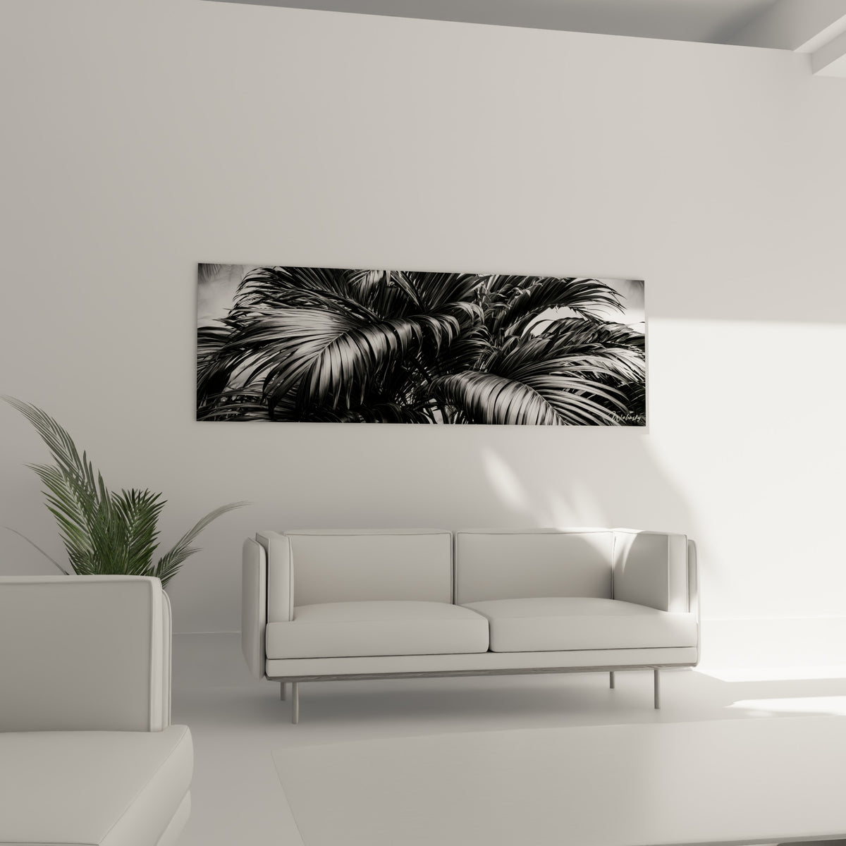 Feuillage tropical monochrome aux nervures marquées, tons gris et anthracite, au-dessus d'un canapé dans un salon lumineux