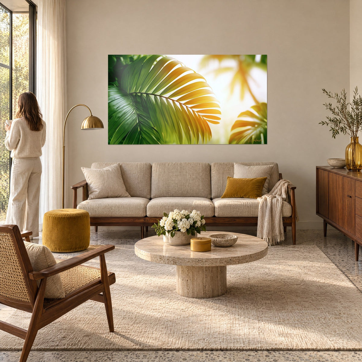 Wall art emerald green and amber gold palm leaf, fan-shaped veins, hanging above a sofa in a bright living room