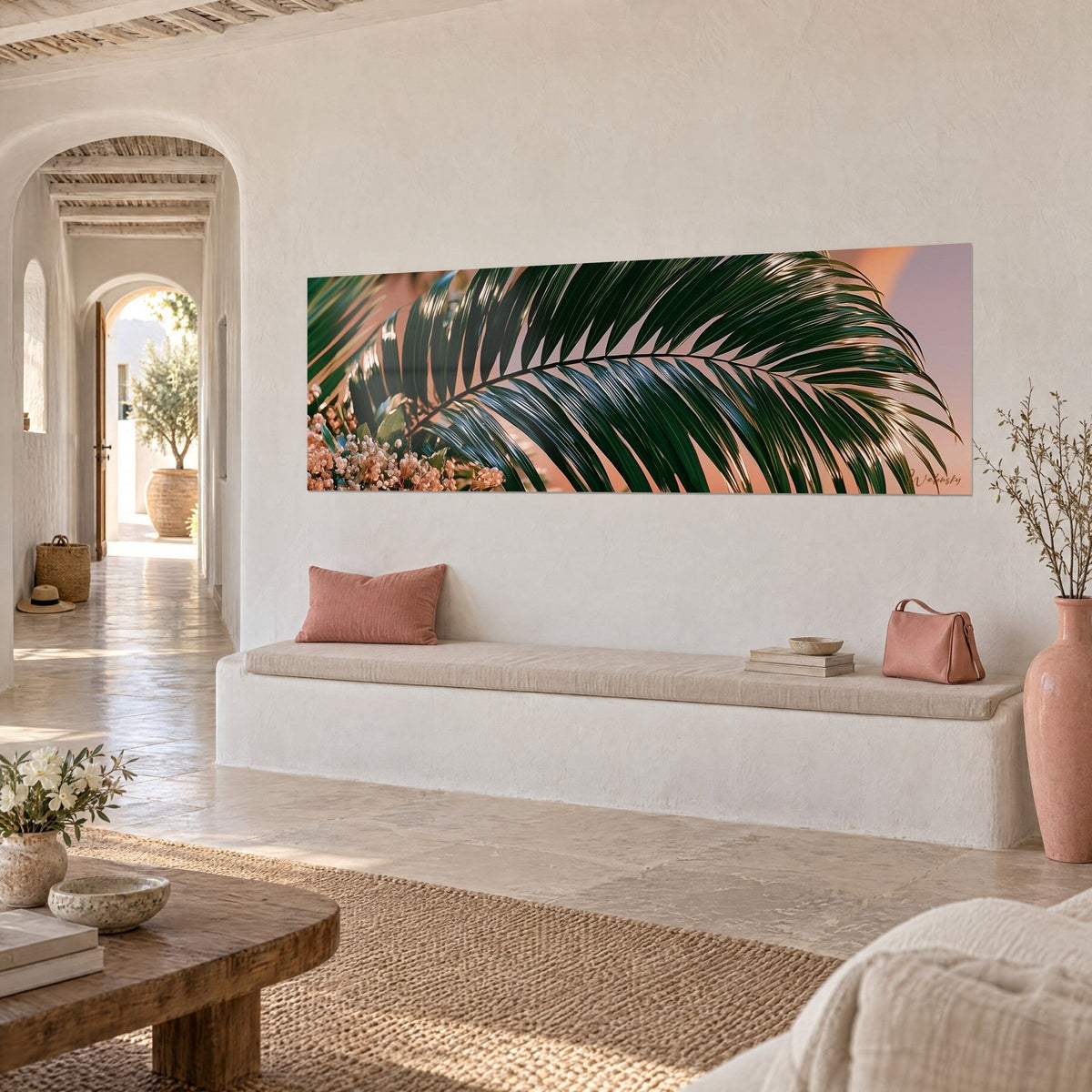 Wall art with a glossy emerald palm leaf curved in an arc, blush beige bouquet on the left, on a white wall above an entryway bench