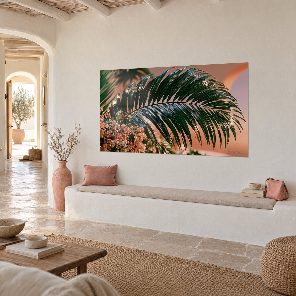 Wall art emerald tropical foliage and copper flower clusters on peach pink background, three-quarter view, white banquette