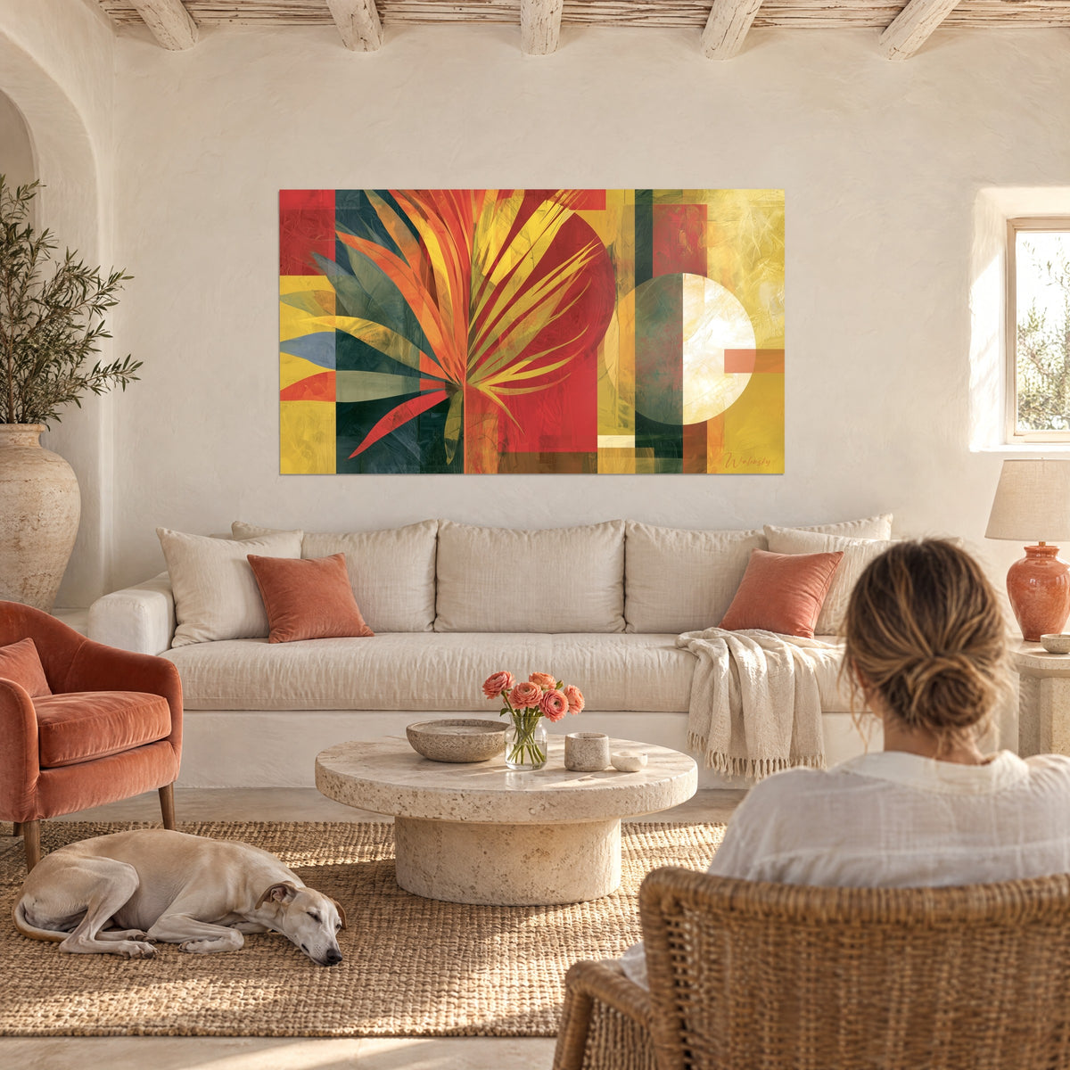Wall art with red and gold fan palm motif and geometric shapes, above a sofa in a bright living room
