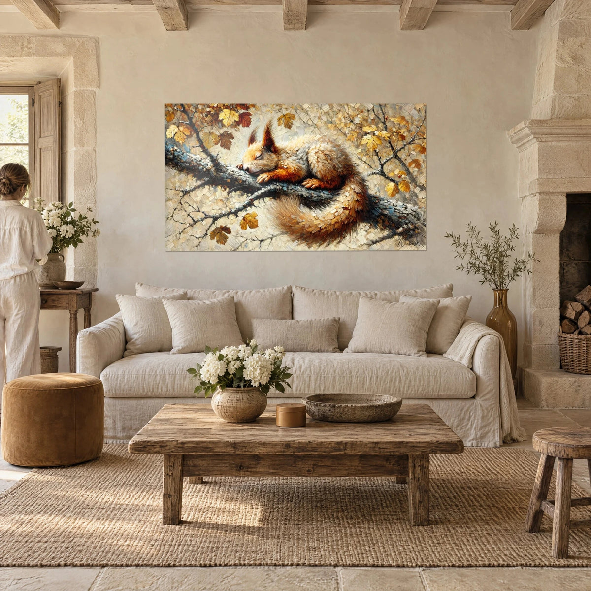 Wall art red squirrel asleep on a branch with ochre and golden leaves, woman seen from behind, above a sofa in a bright living room