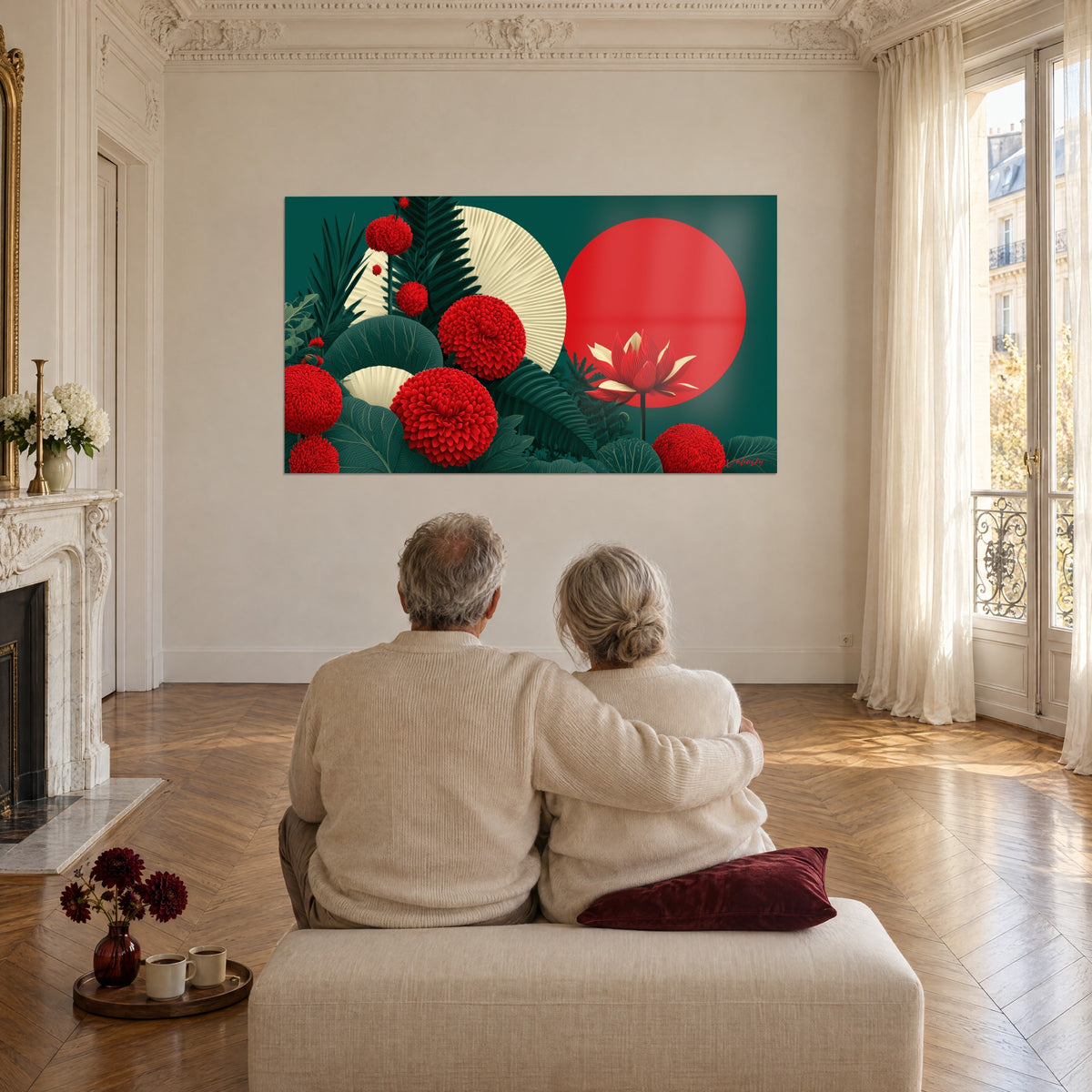 Wall art abstract floral in red and dark green, purple disc, cream fan, facing two elderly people embracing on a pouf in a parquet-floored living room
