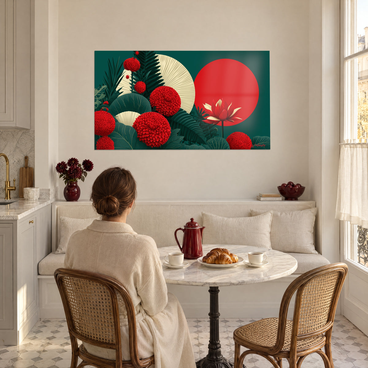 Wall art vermilion dahlias in pompom shape, red moon and beige fans, green leaves, facing a couple seated at a table in a bright kitchen