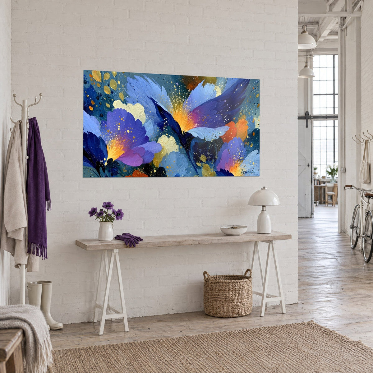 Wall art with abstract blossoms in thick impasto, saffron-yellow centers and sky-blue petals, on a white brick wall