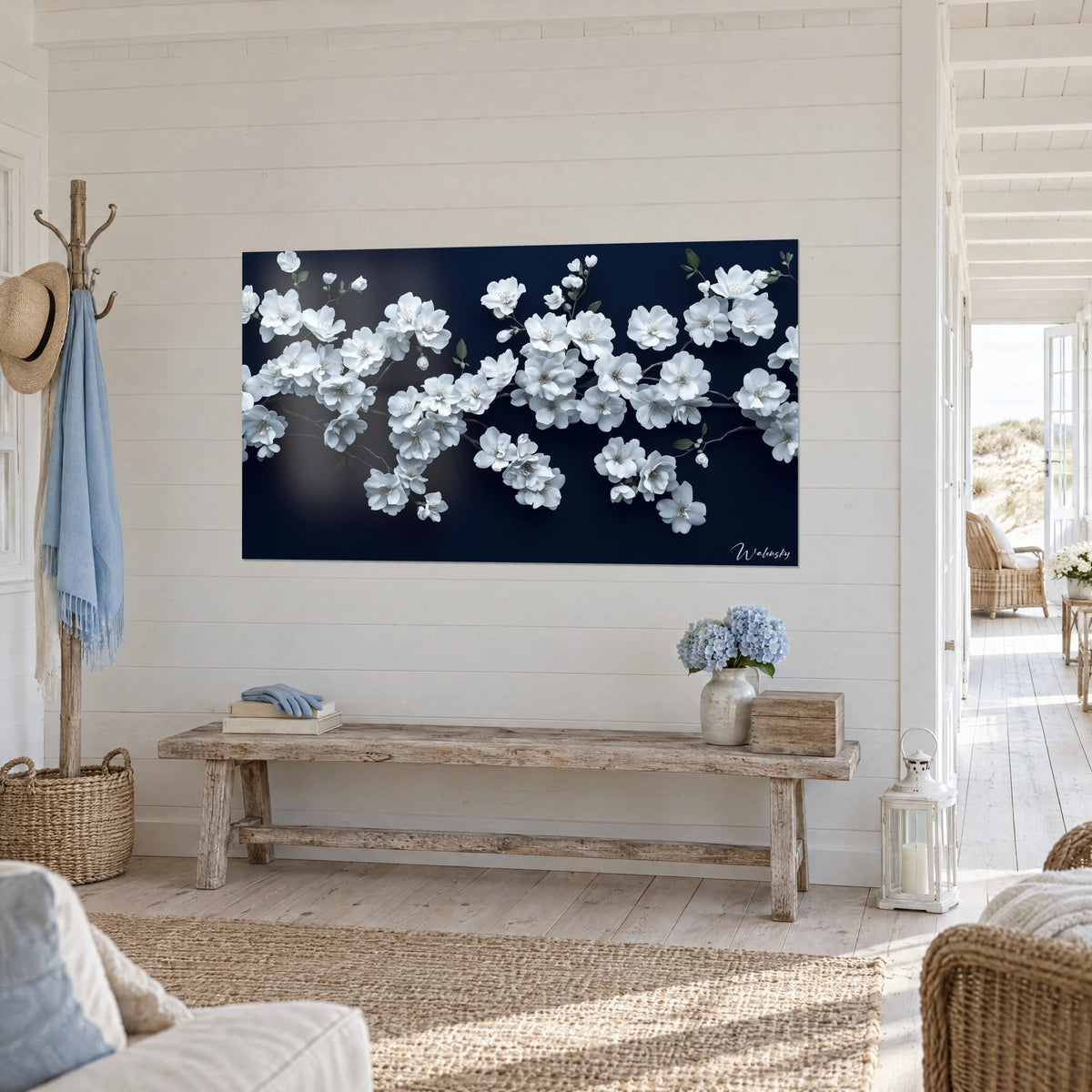 Tableau branches de sakura chargées de pétales blancs et de feuilles vert sauge sur bleu marine, banc en bois, vue de trois-quarts