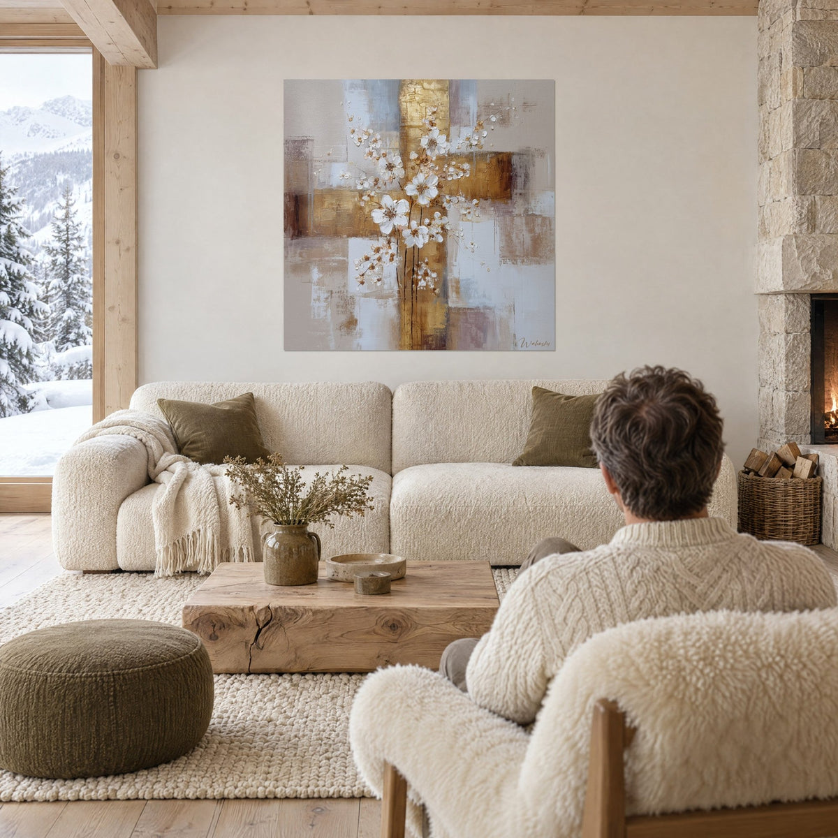 Tableau cerisier en fleurs blanc et or sur croisillon doré, au-dessus d'un canapé dans un salon lumineux