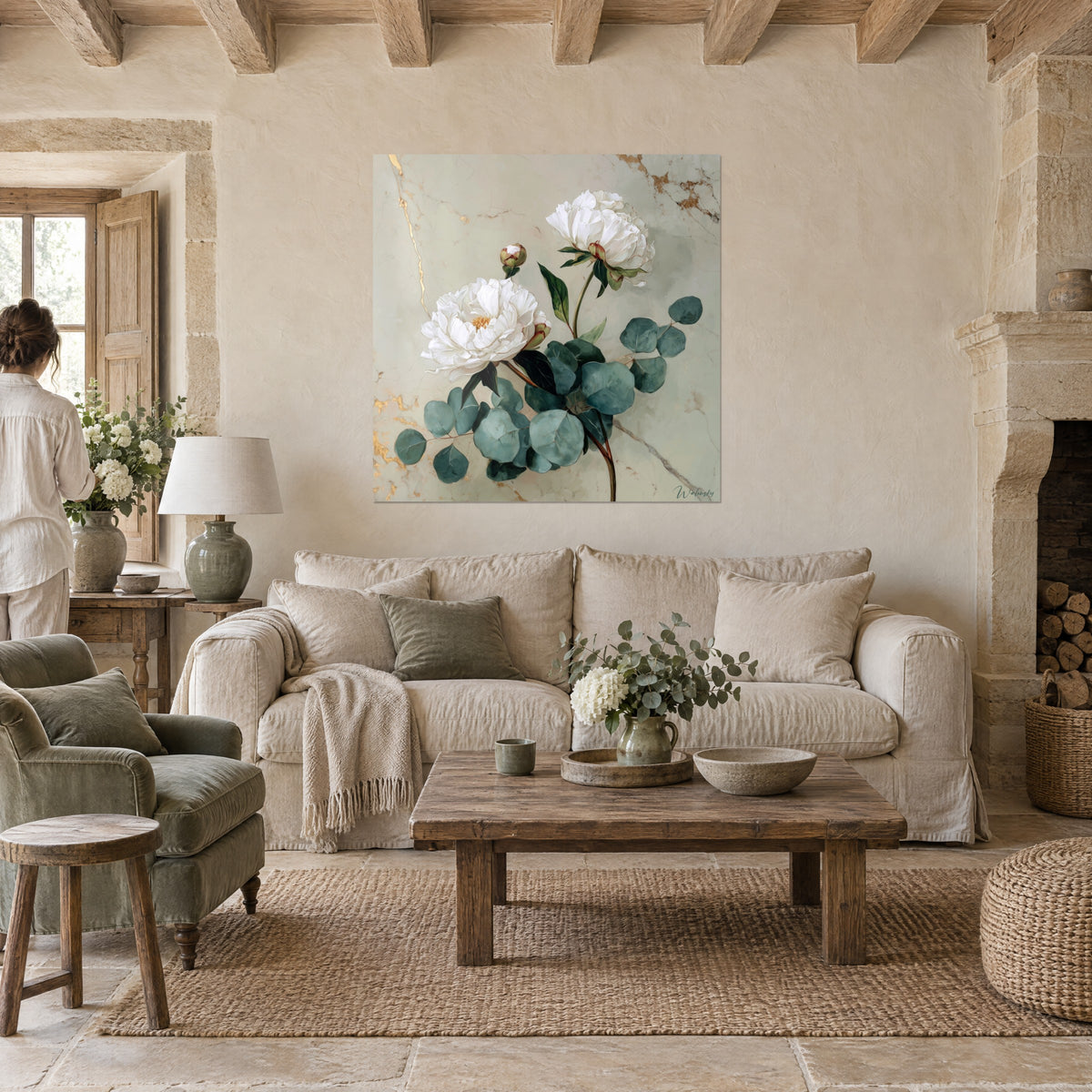 Wall art white peonies and verdigris eucalyptus on gold-veined marble, two people seen from behind, above a sofa in a bright living room