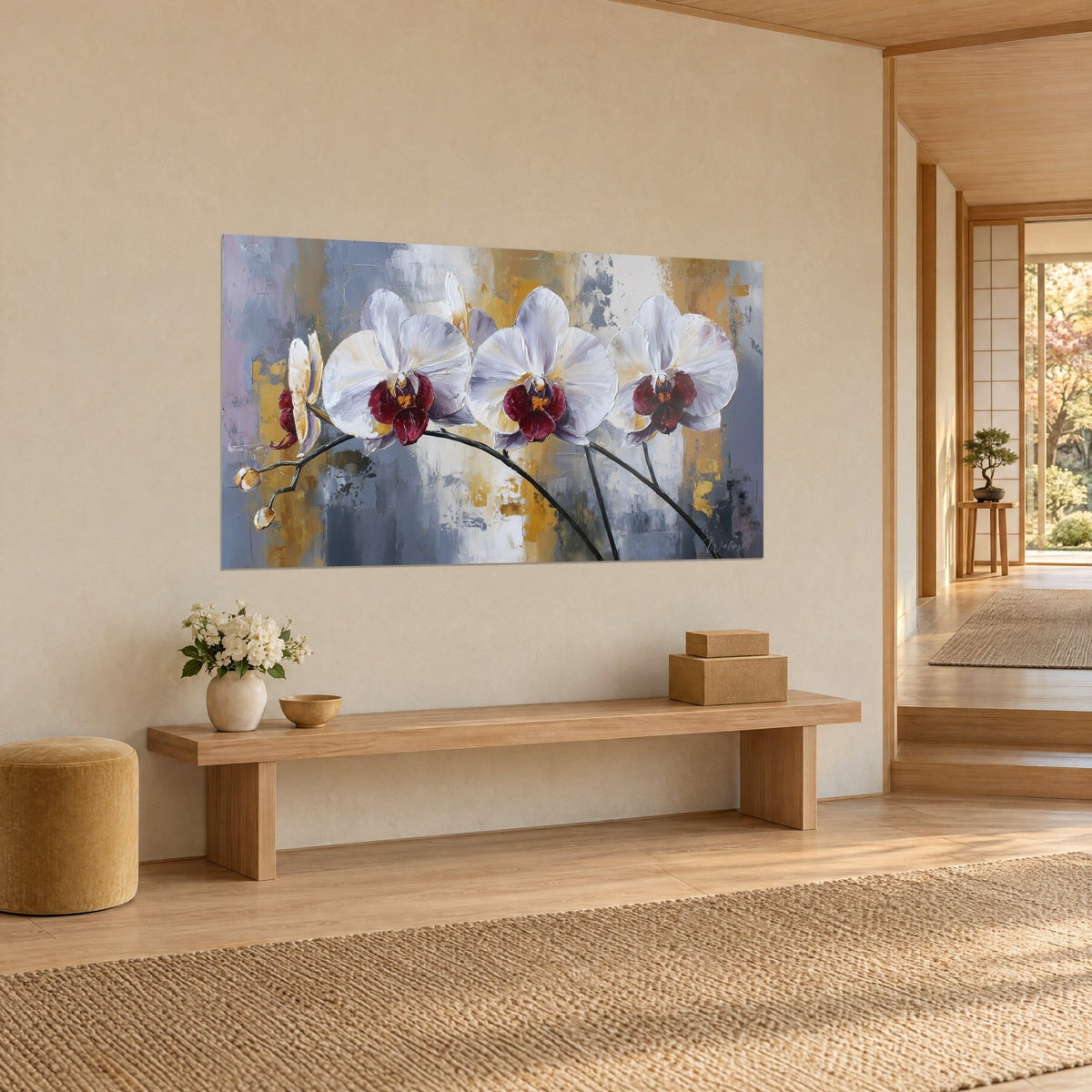 Wall art three ivory and burgundy phalaenopsis on arched black stems, grey-blue and gold background, three-quarter view on a beige wall