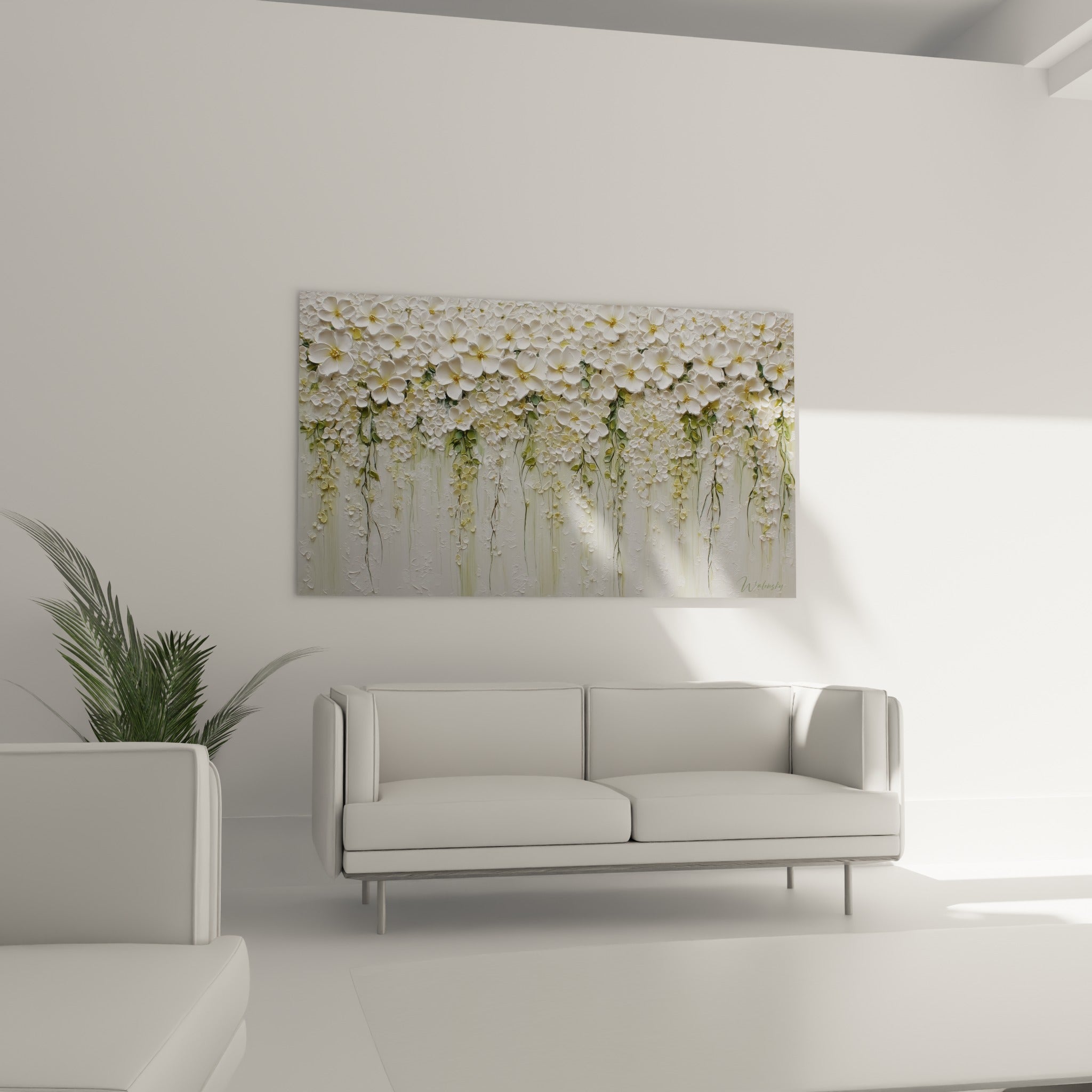 Corolles blanches à cœur doré et tiges vert sauge au-dessus d'un canapé dans un salon lumineux