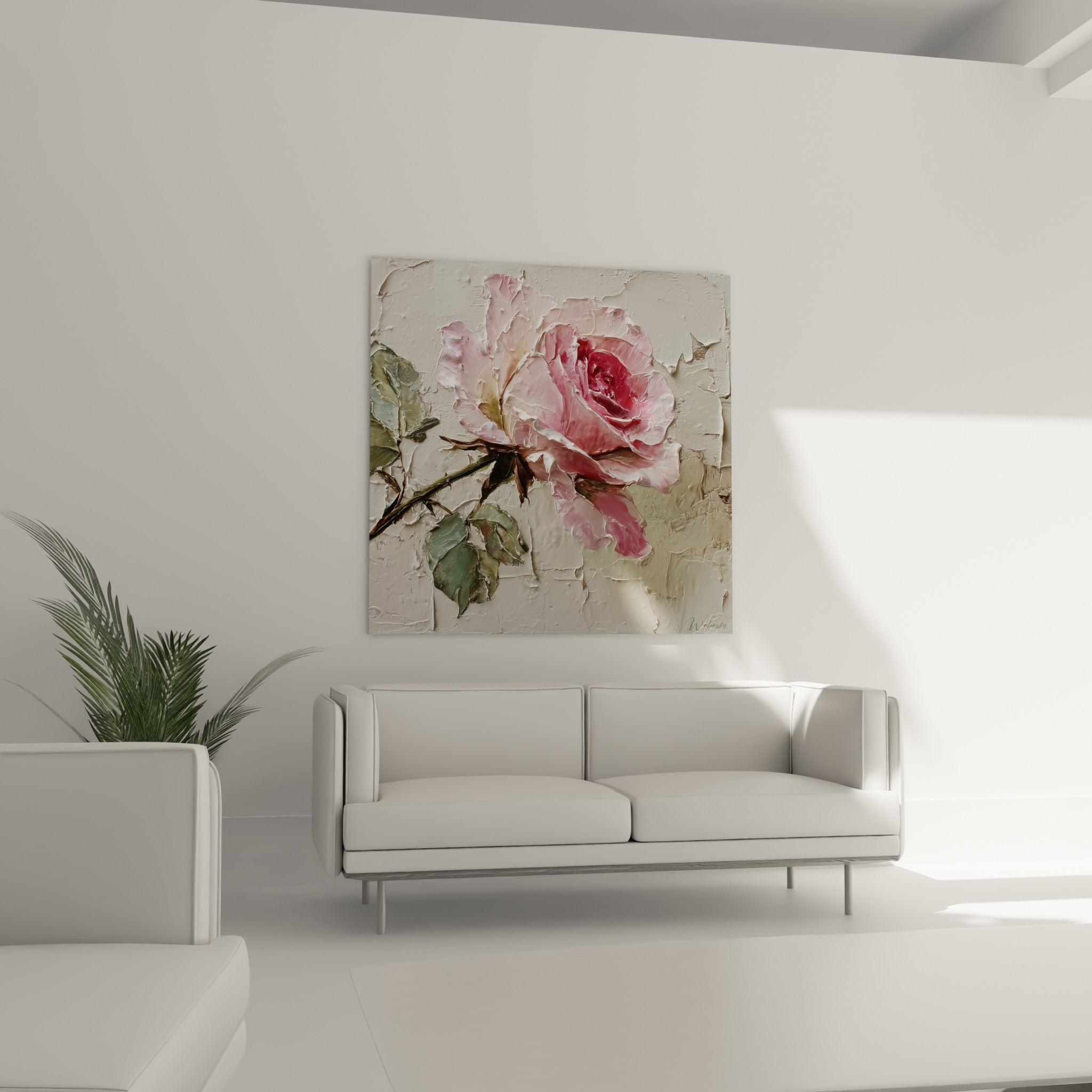 Pétales rose pâle et cœur carmin d'une rose suspendus au-dessus d'un canapé dans un salon lumineux