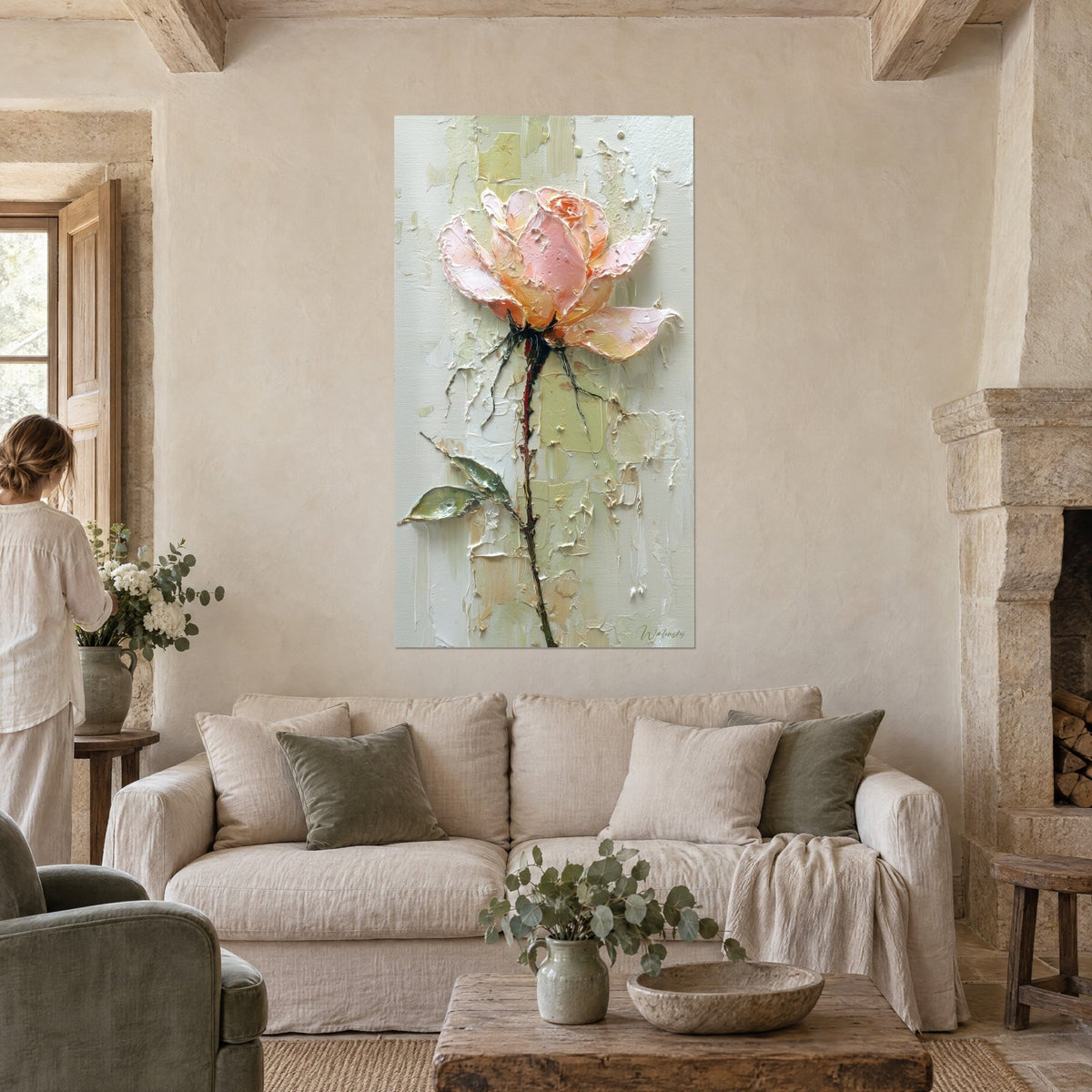 Wall art of a peach-pink rose with thickly applied petals in pale pink and orange, slender stem, sea-green wall, above a sofa in a bright living room