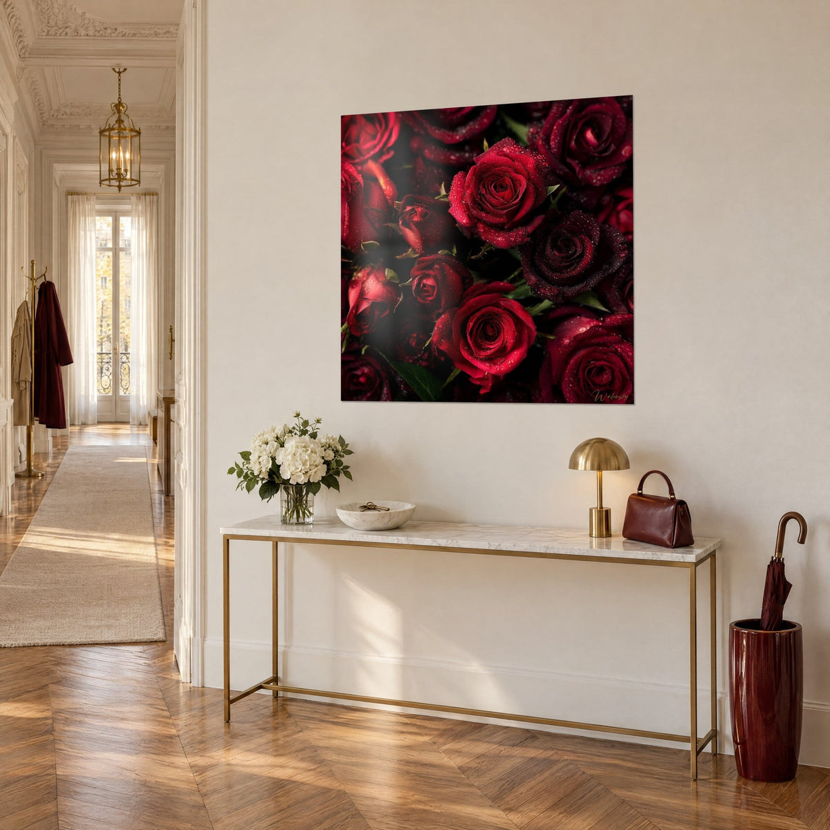 Wall art close-up floral of carmine and burgundy roses, crystalline dewdrops, green foliage, on a gilded console table, three-quarter view