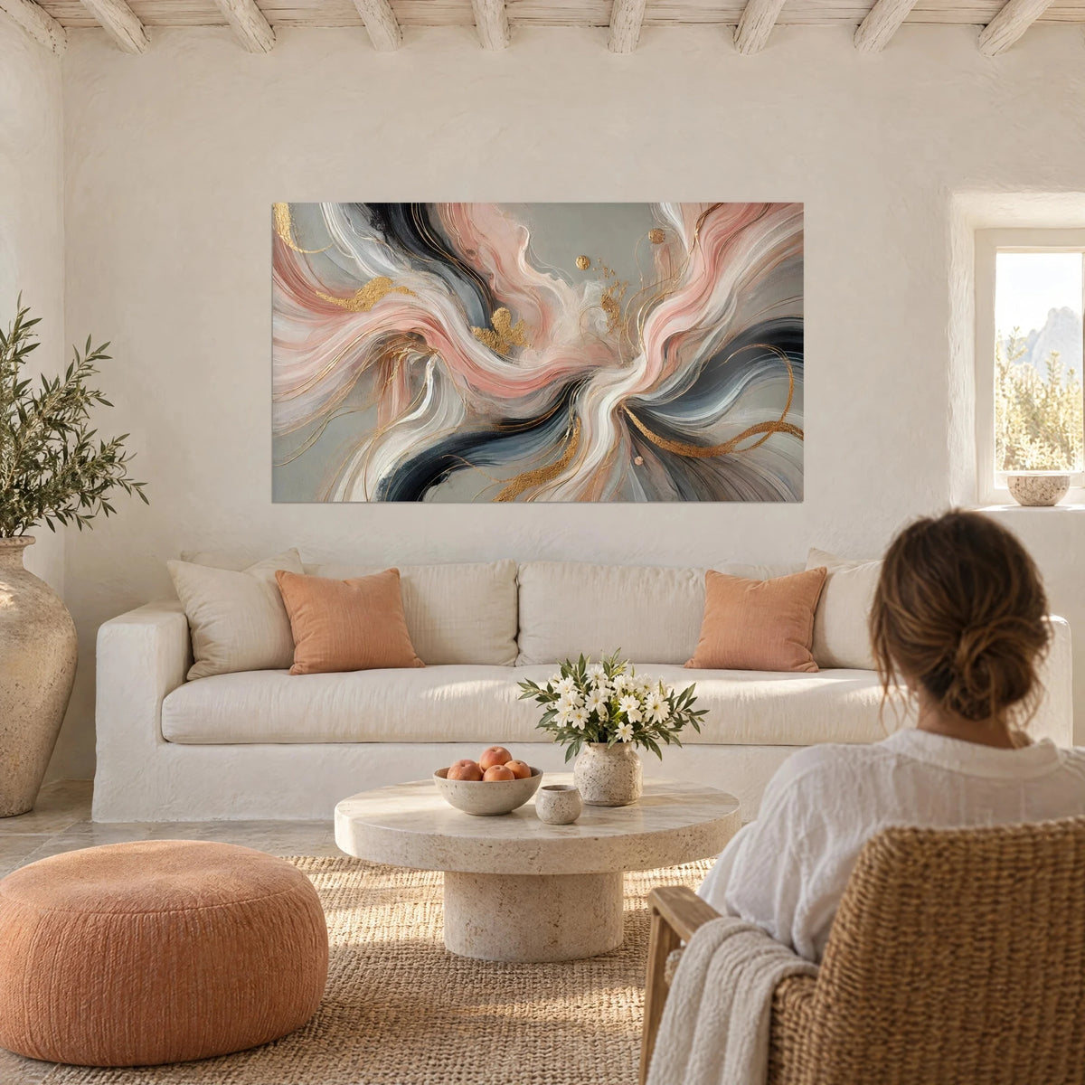 Wall art with abstract powder-pink and charcoal-black swirls, gold pinstripes, above a sofa in a bright living room