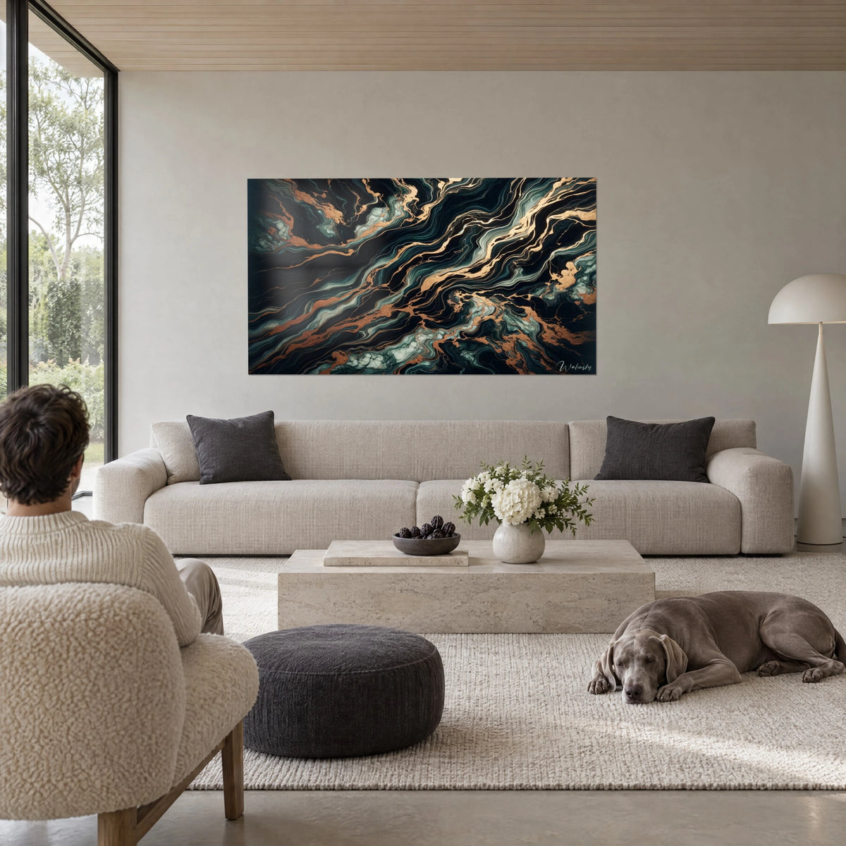 Wall art with black marble veins threaded with copper and sage green lines, man and dog seen from behind, above a sofa in a bright living room